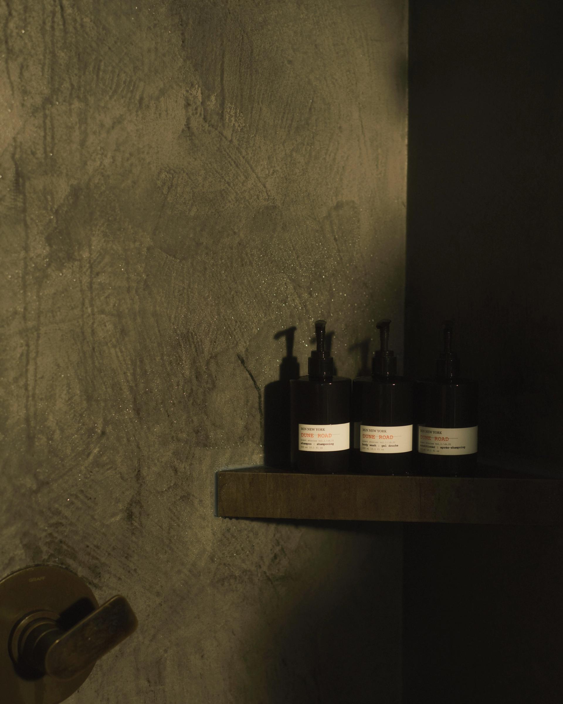 MiN New York Dune Road Shampoo, Conditioner and Body Wash dispensers on shower shelf