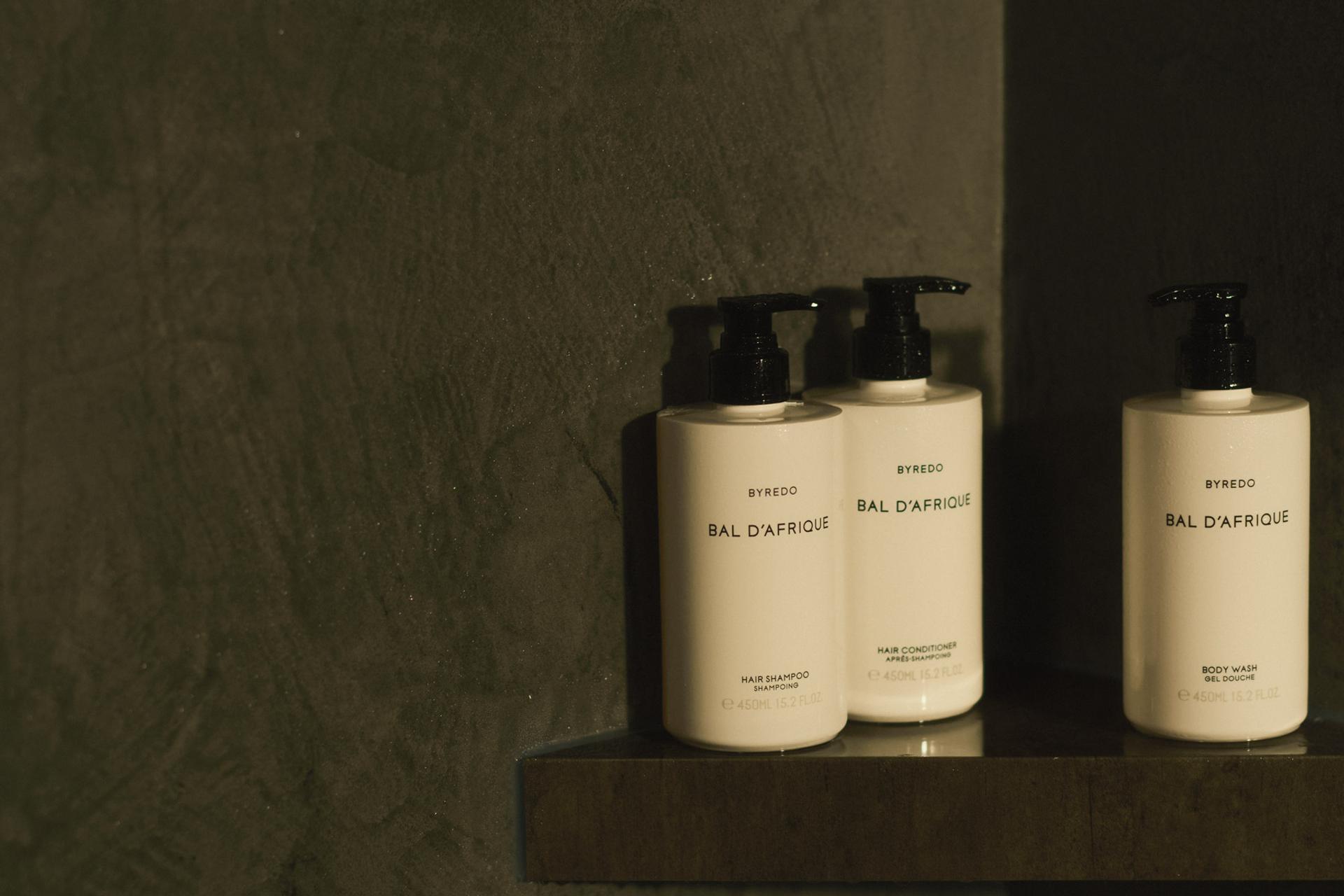Byredo Bal d'Afrique Body Wash, Shampoo and Conditioner on shower shelf