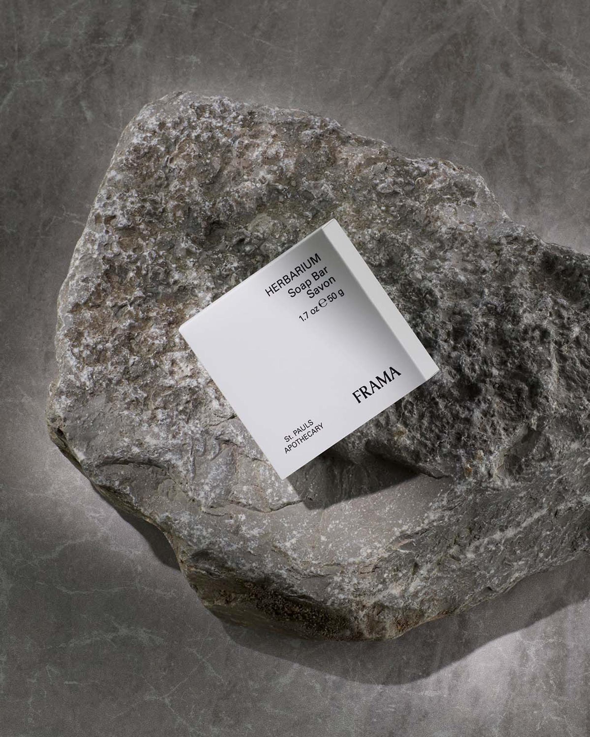 Frama Herbarium boxed Soap Bar sitting on rock