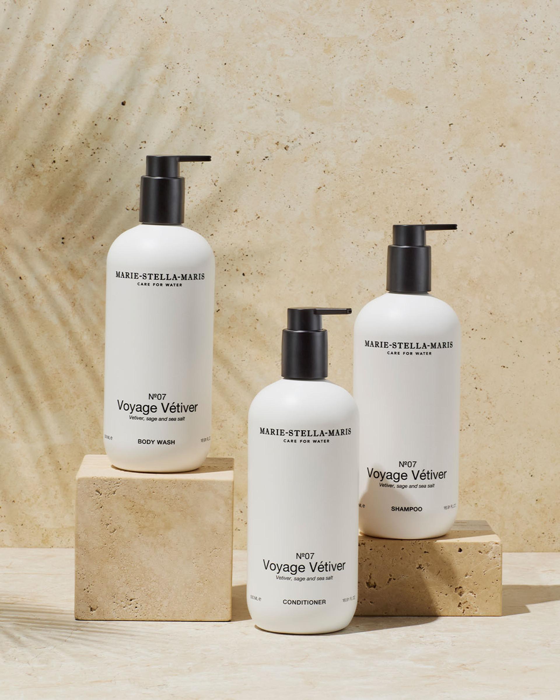 Marie Stella Maris Voyage Vetiver Shampoo, Conditioner and Body Wash dispensers on counter