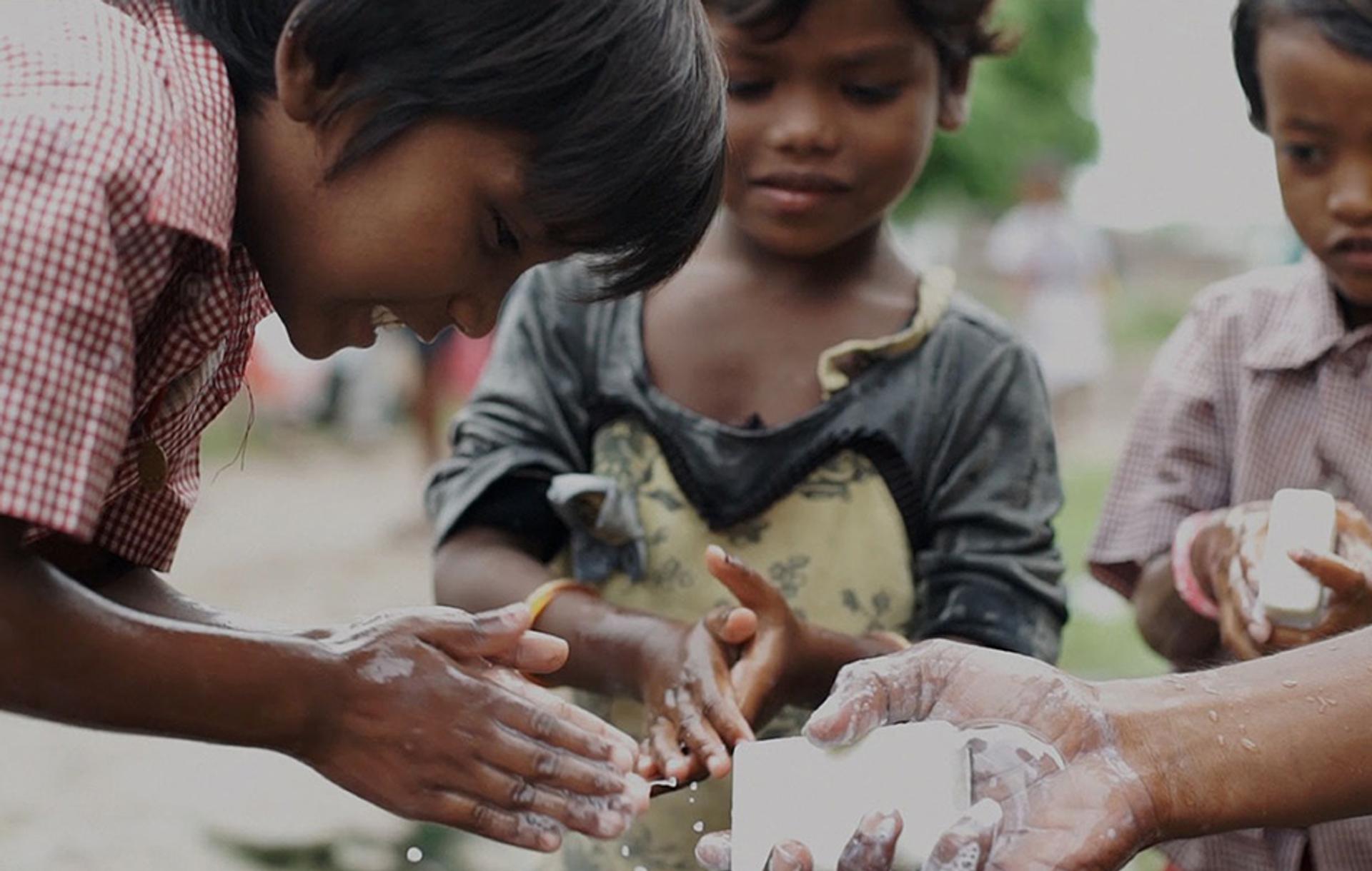 Kids Washing Hands with Soap Aid bars of soap