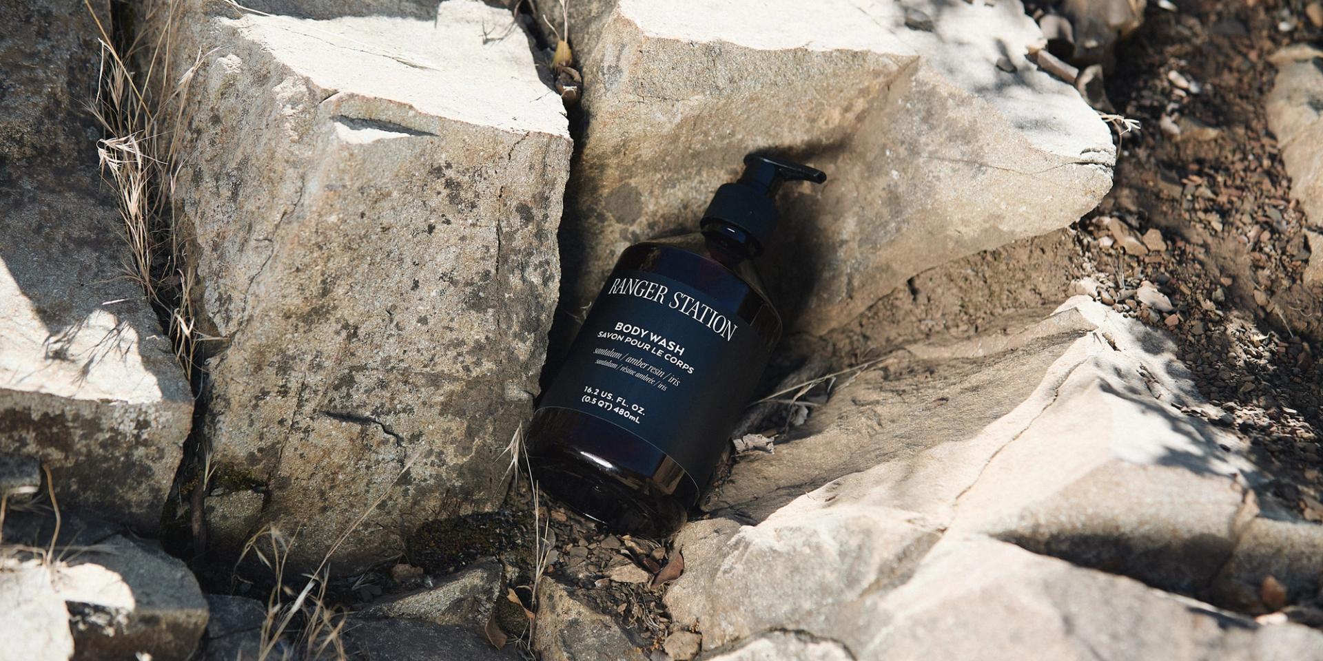Ranger Station Santalum Body Wash positioned between rocks