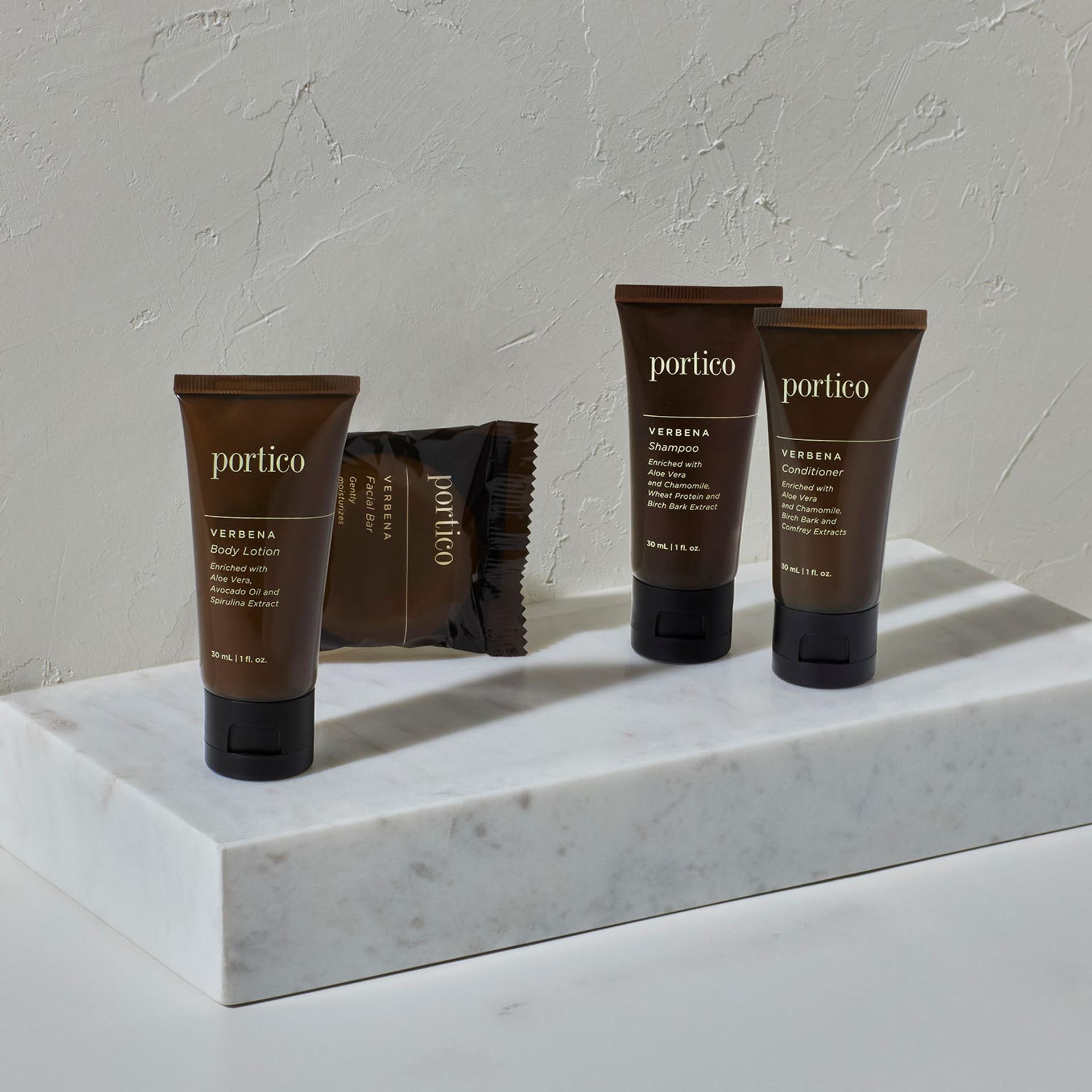 Portico Verbena single-use amenity collection on marble top