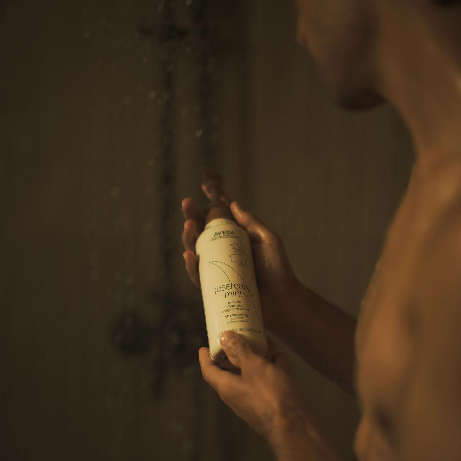 Aveda Rosemary Mint Shampoo in shower with guy