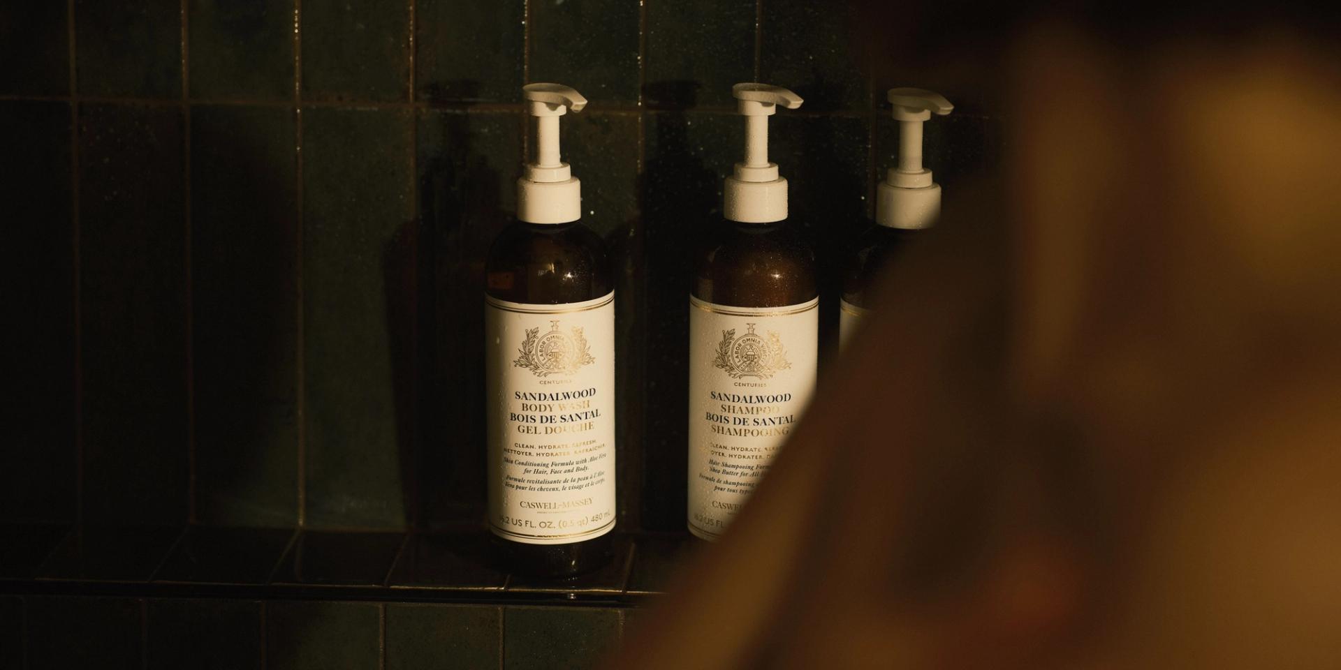 Caswell-Massey Sandalwood Body Wash, Shampoo and Conditioner on shower shelf