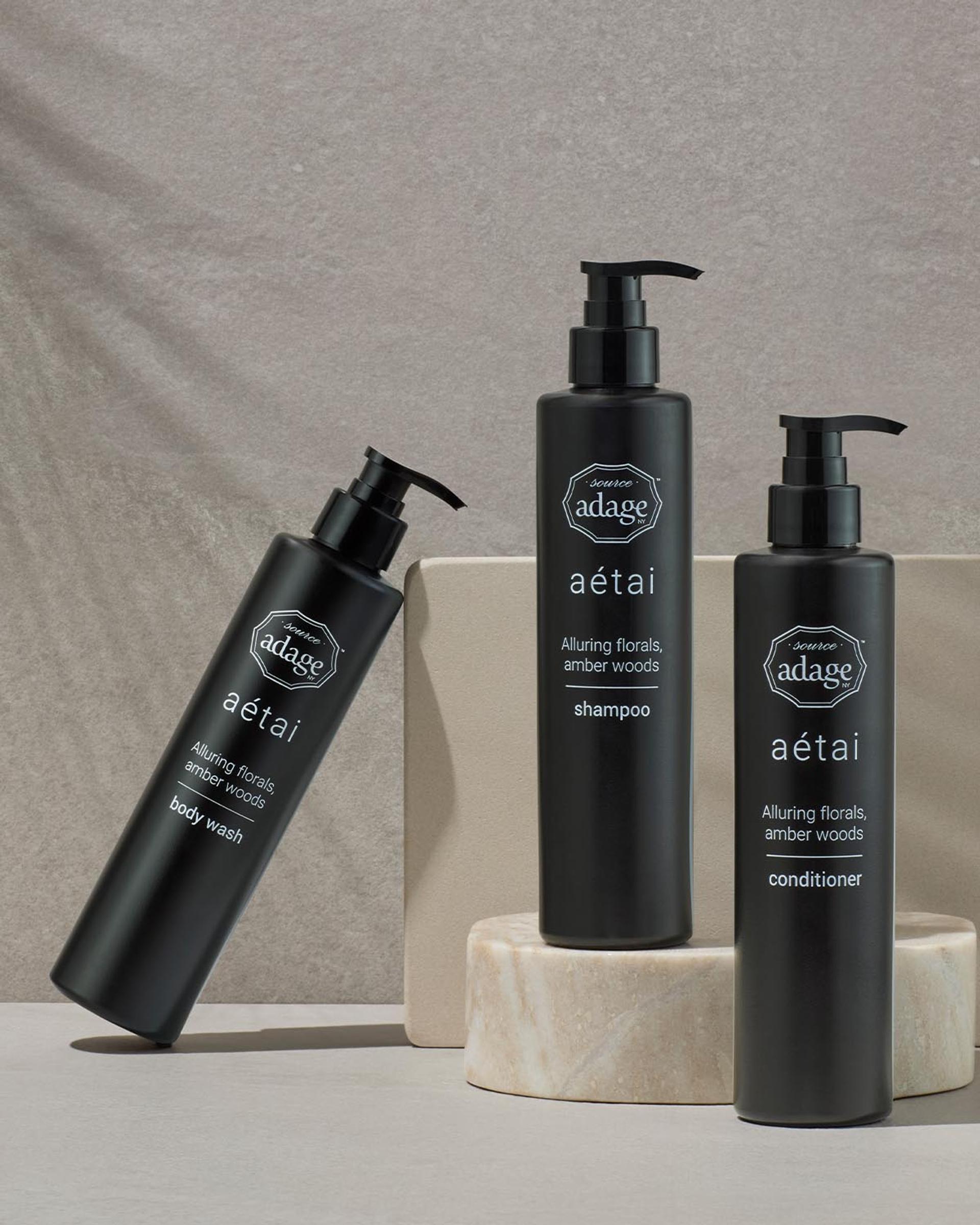 Source Adage Aetai Shampoo, Conditioner, and Body Wash dispensers on bathroom vanity