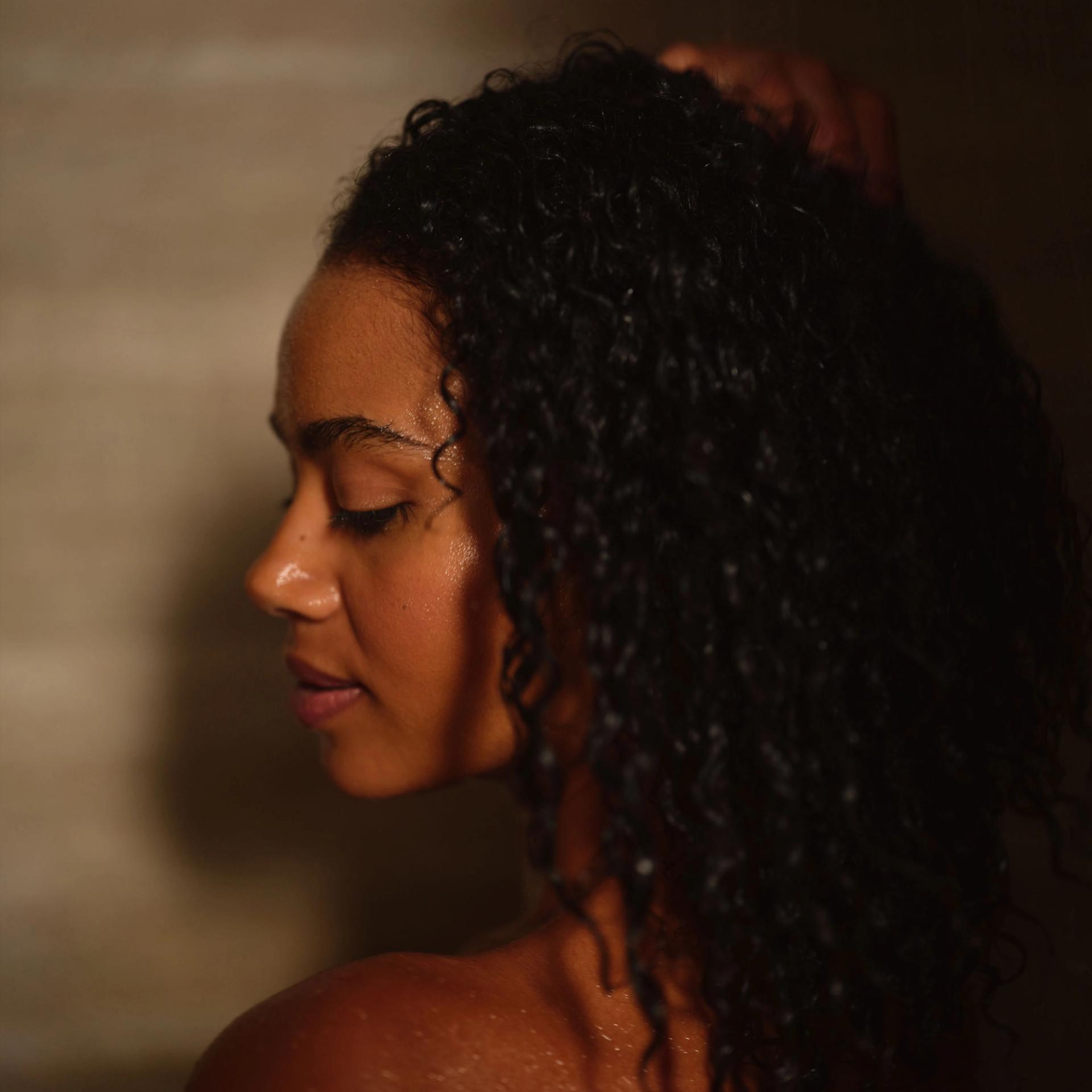 Model washing hair.