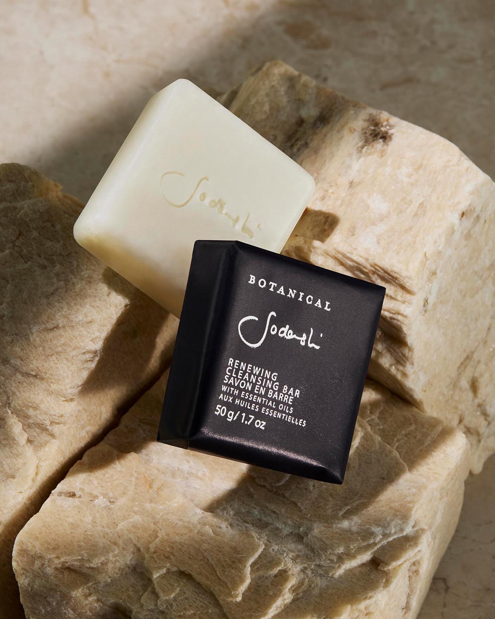 Sodashi Renewing soap bar laying on stone