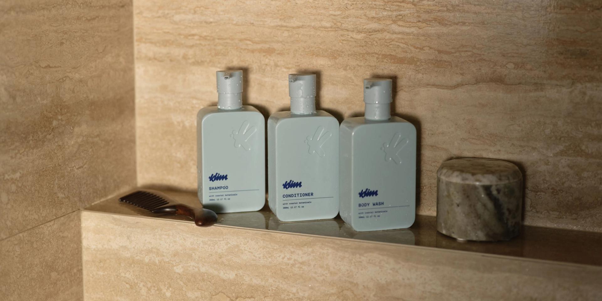 Klima Shampoo, Conditioner, Body Wash in the shower.