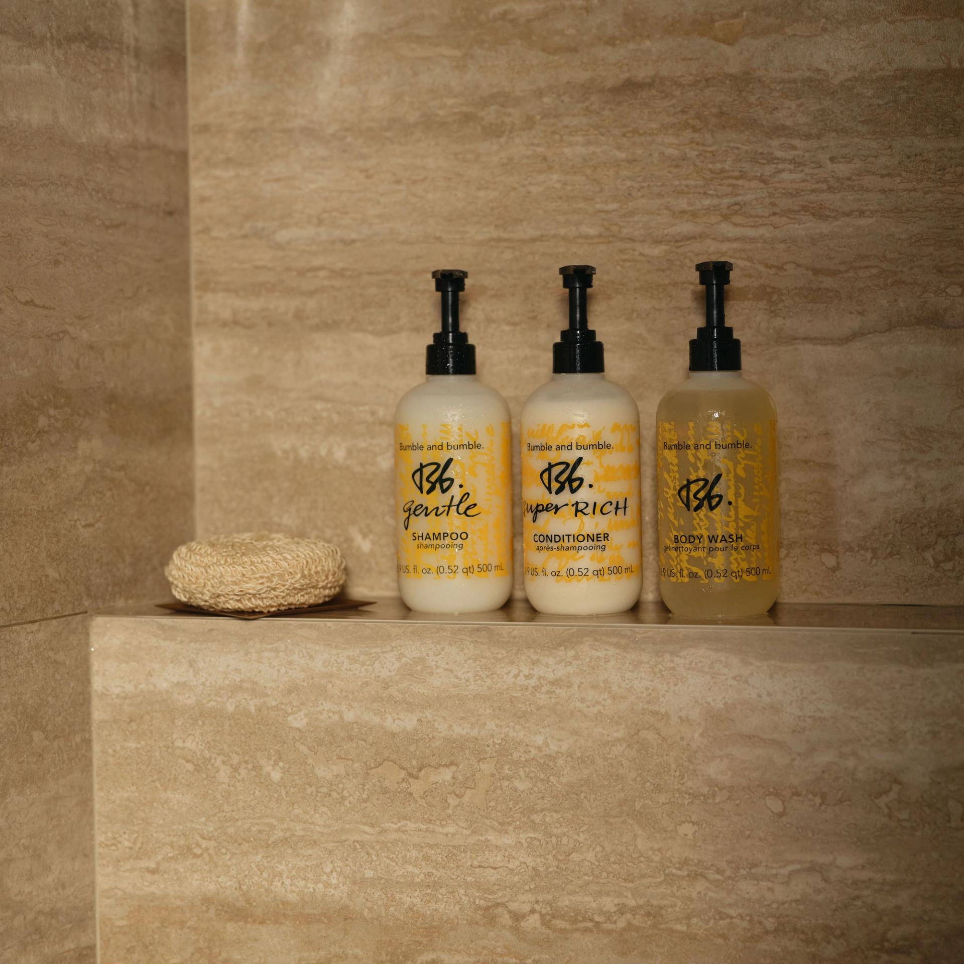 Bumble&bumble Shampoo, Conditioner, Body Wash 500ml in the shower.