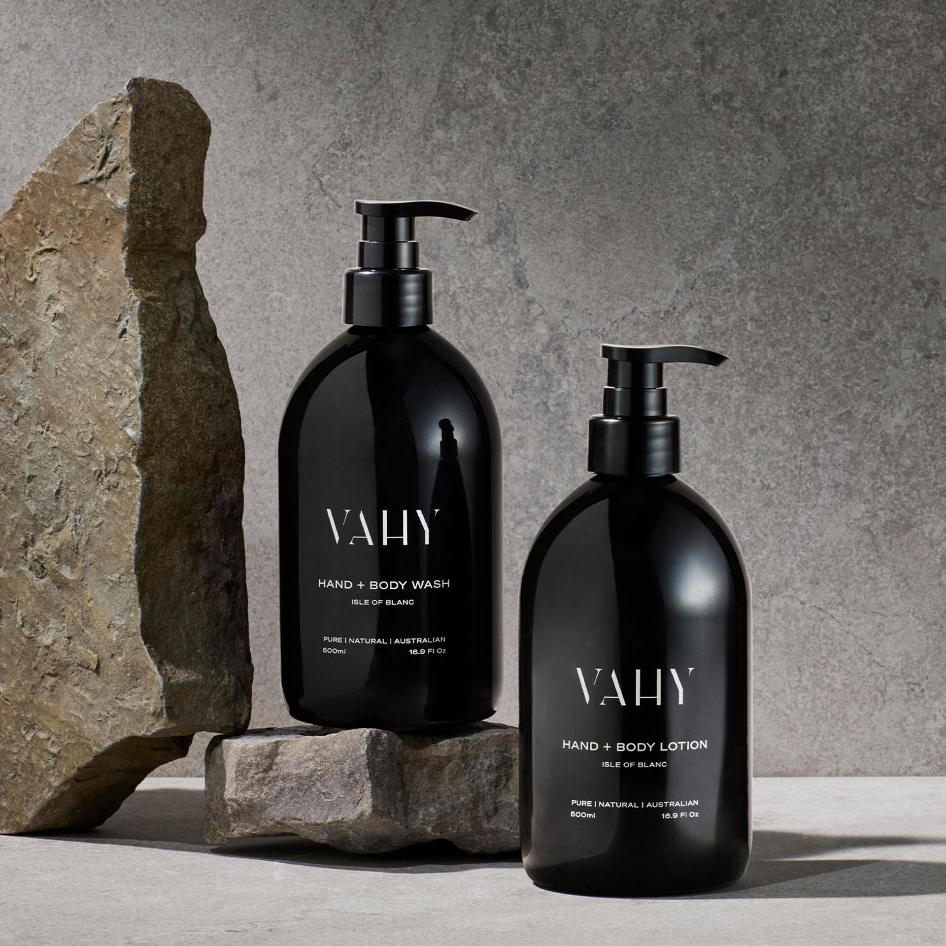 Vahy Isle of Blance Hand Wash and Body Lotion dispensers on stone bathroom vanity