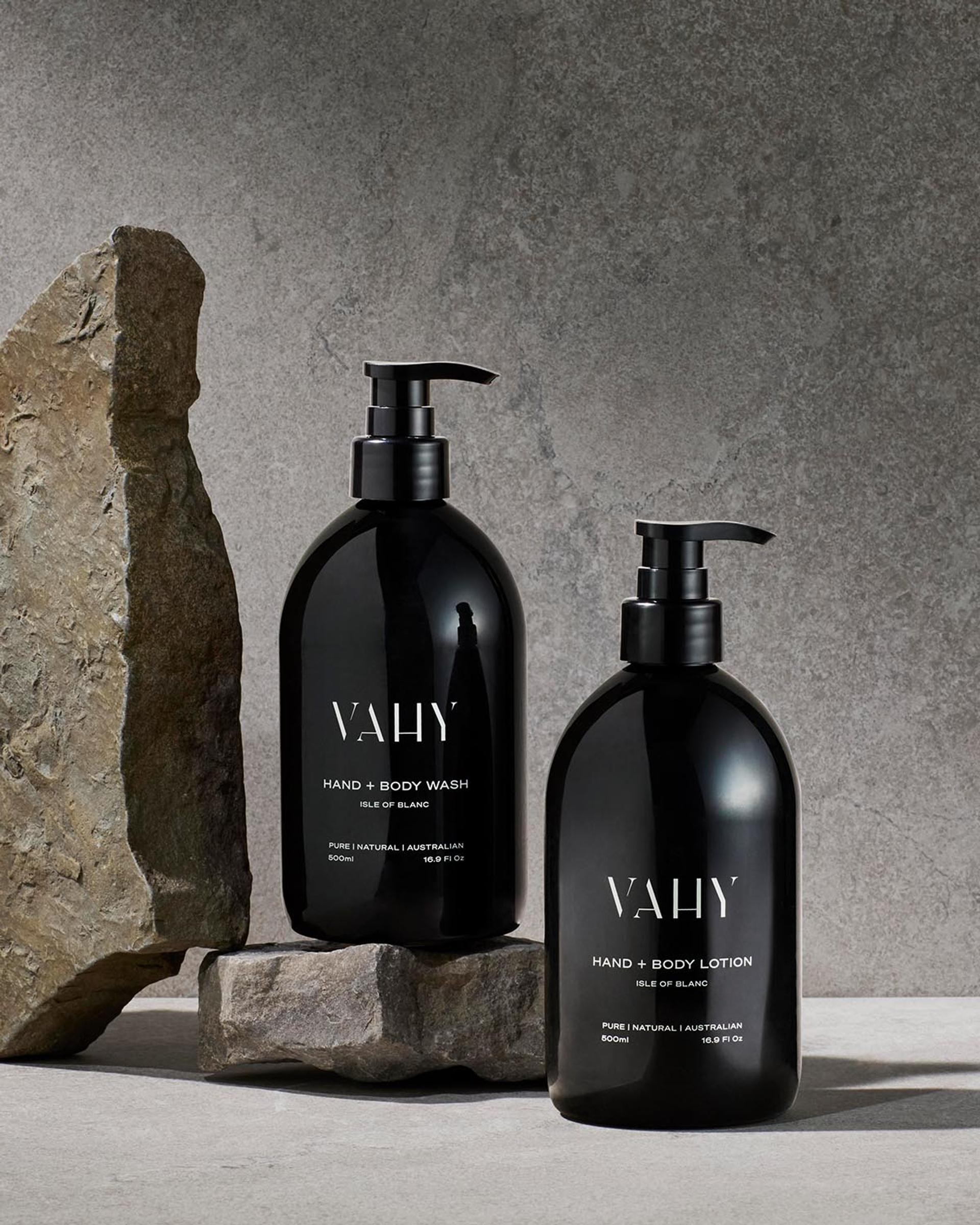 Vahy Isle of Blance Hand Wash and Body Lotion dispensers on stone bathroom vanity