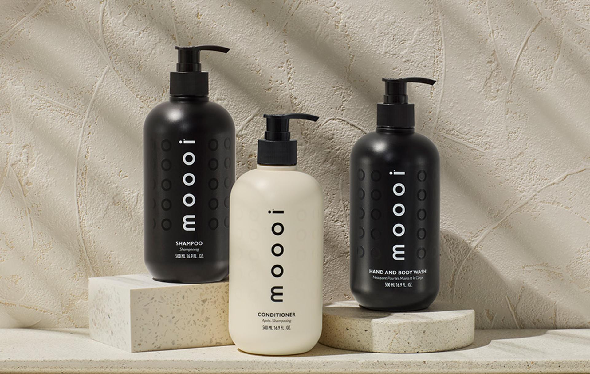 Moooi Shampoo, Conditioner and Body Wash dispensers on counter