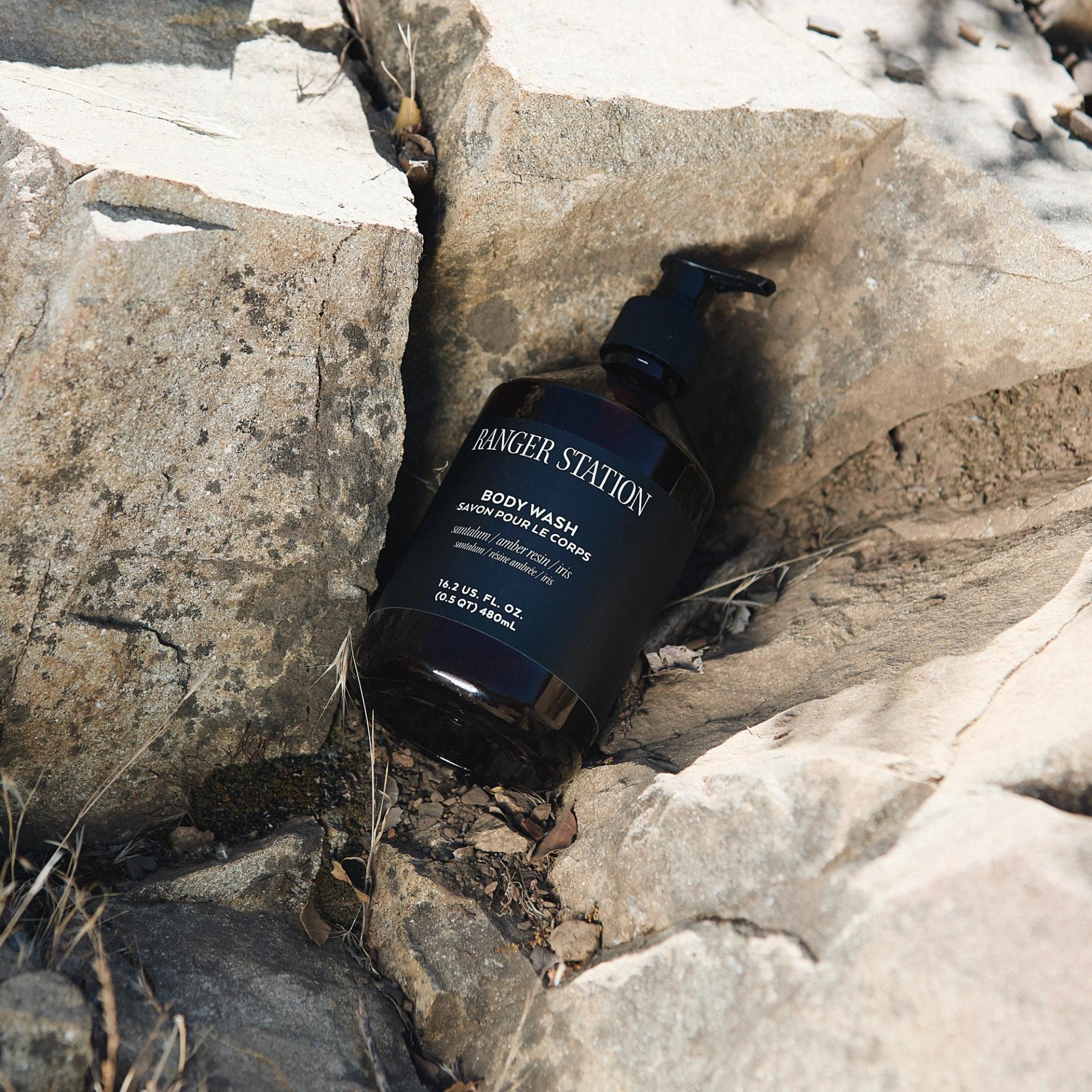 Ranger Station Santalum Body Wash positioned between rocks