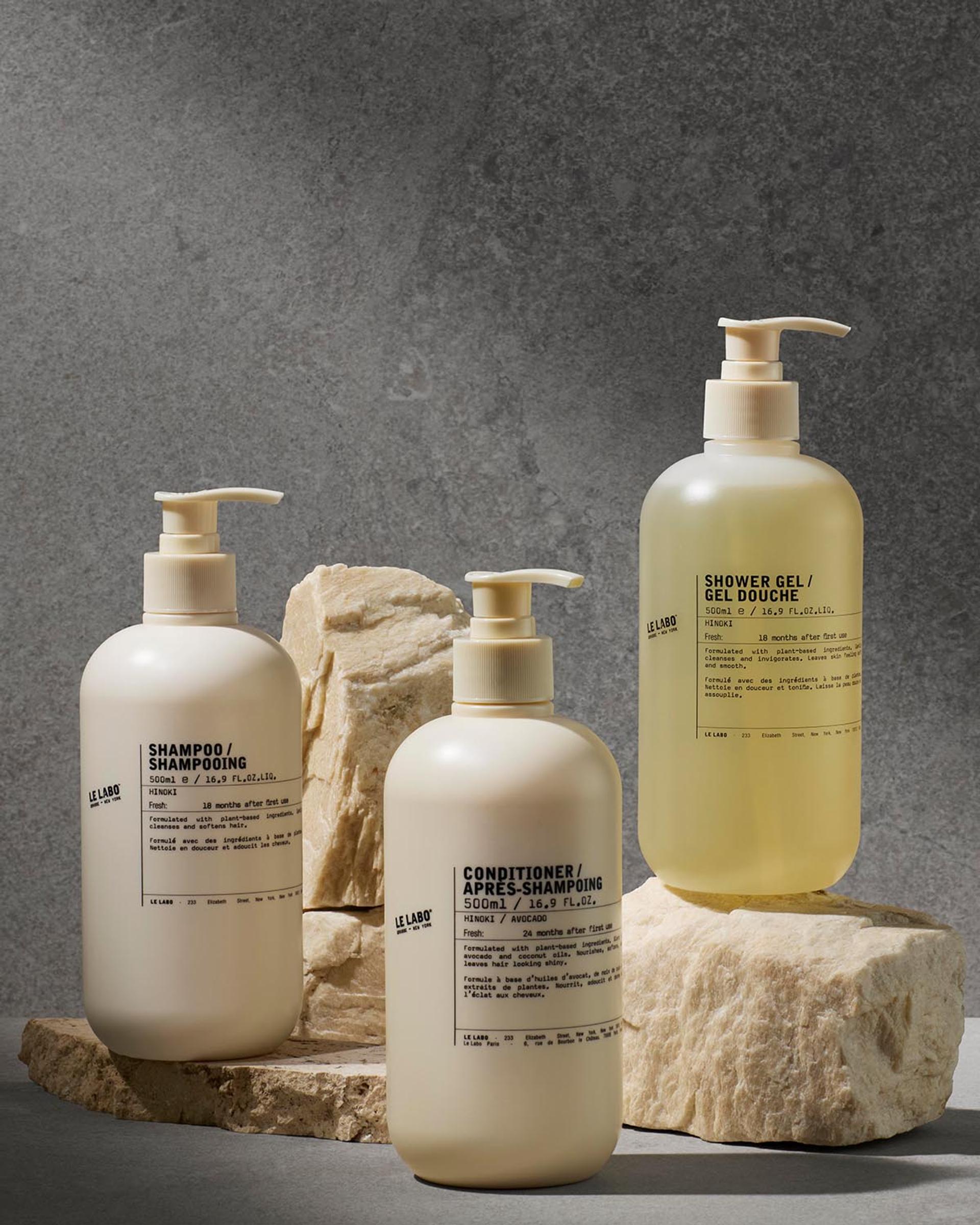 Le Labo Hinoki Shampoo, Conditioner and Shower Gel dispensers on counter