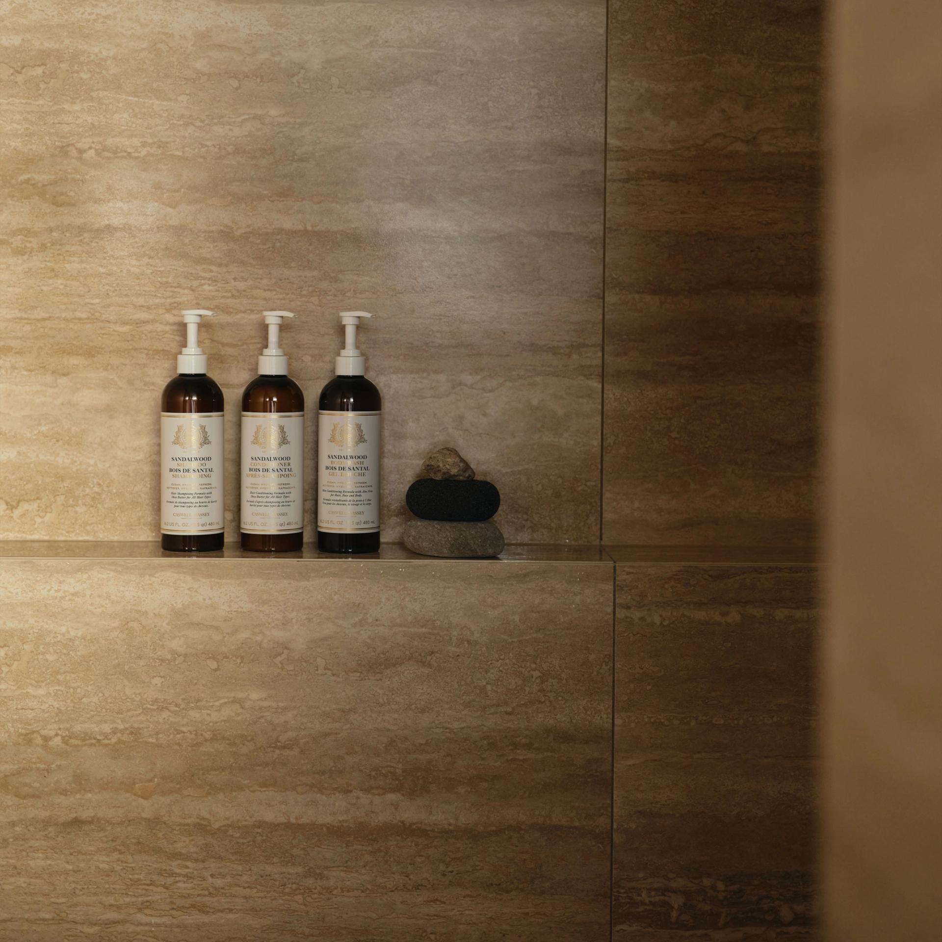 Caswell Massey Shampoo, Conditioner, Body Wash 480ml in the shower.