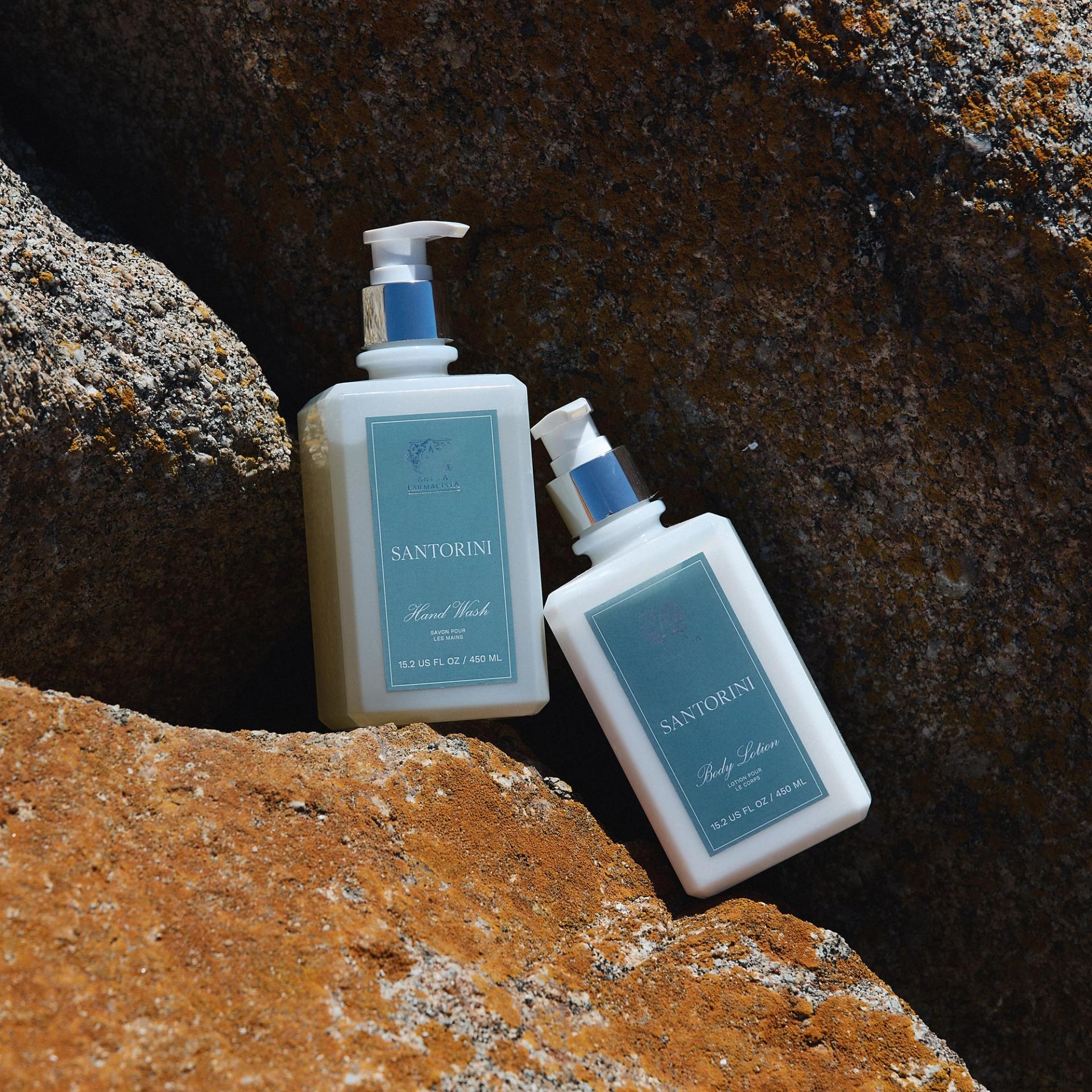 Antica Farmacista Hand Wash and Body Lotion Bottles sitting on rocks outdoors
