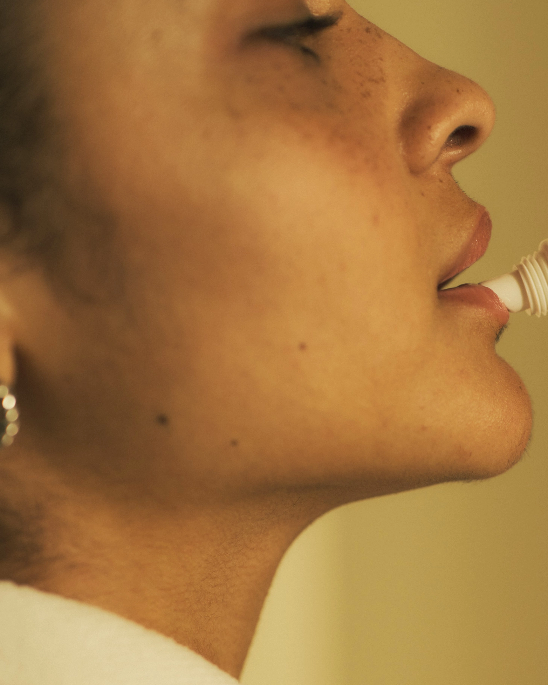 Girl applying Cela Lip Balm