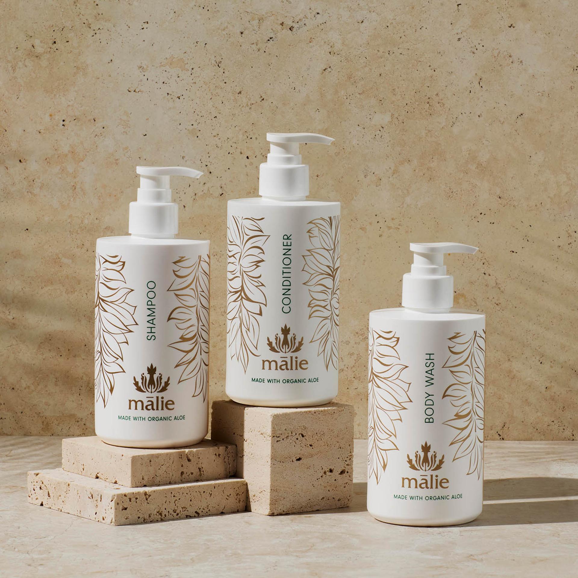 Malie Koke'e Shampoo, Conditioner and Body Wash dispensers on counter