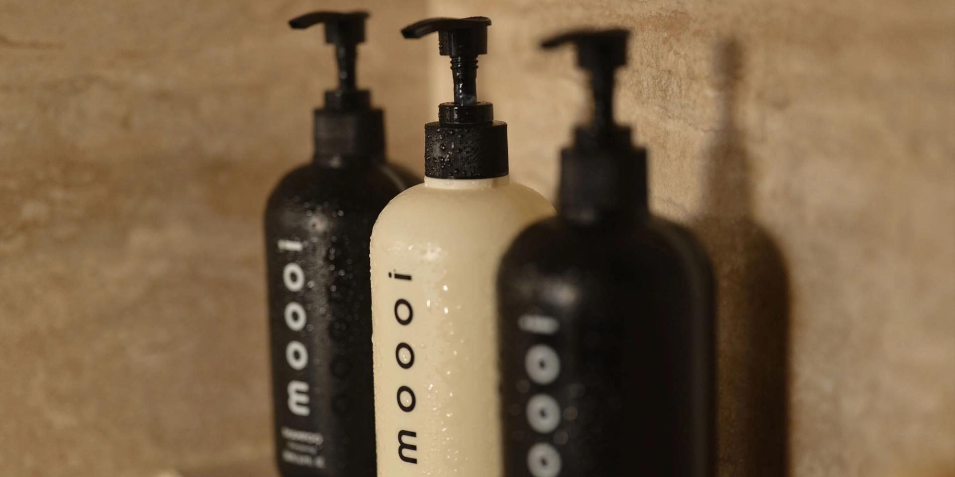 Moooi Shampoo, Conditioner, Body Wash in the shower.