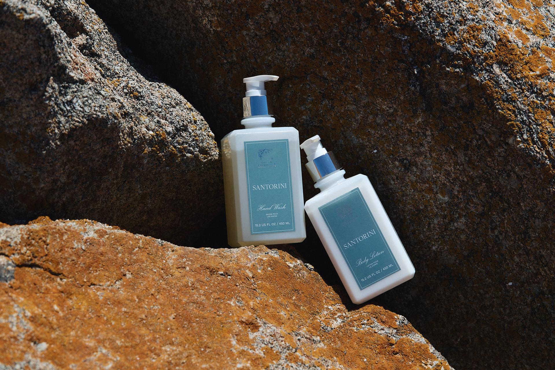 Antica Farmacista Hand Wash and Body Lotion Bottles sitting on rocks outdoors