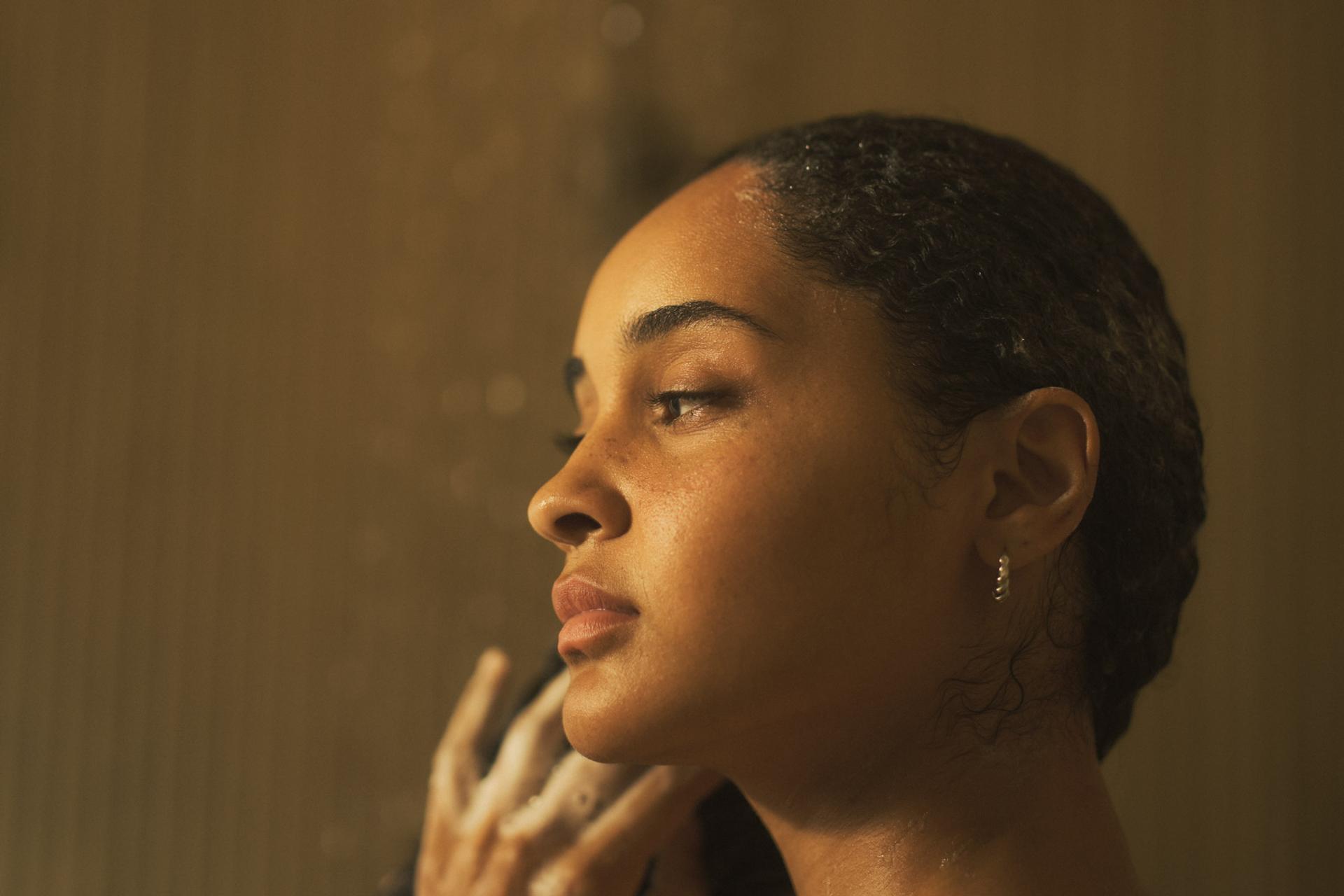 Girl in shower lathering hair