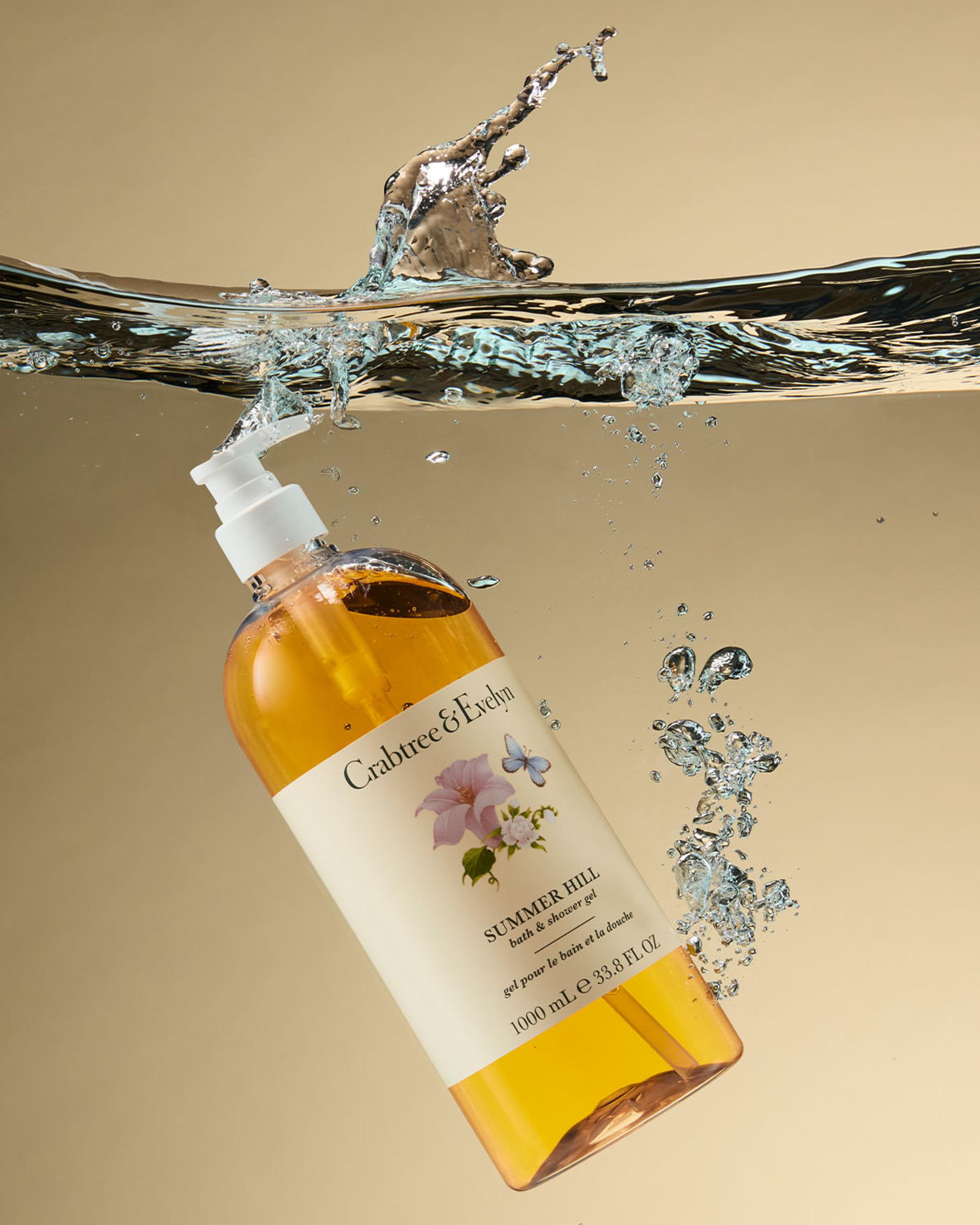 Crabtree & Evelyn Summer Hill Bath & Shower Gel bottle submerged in water