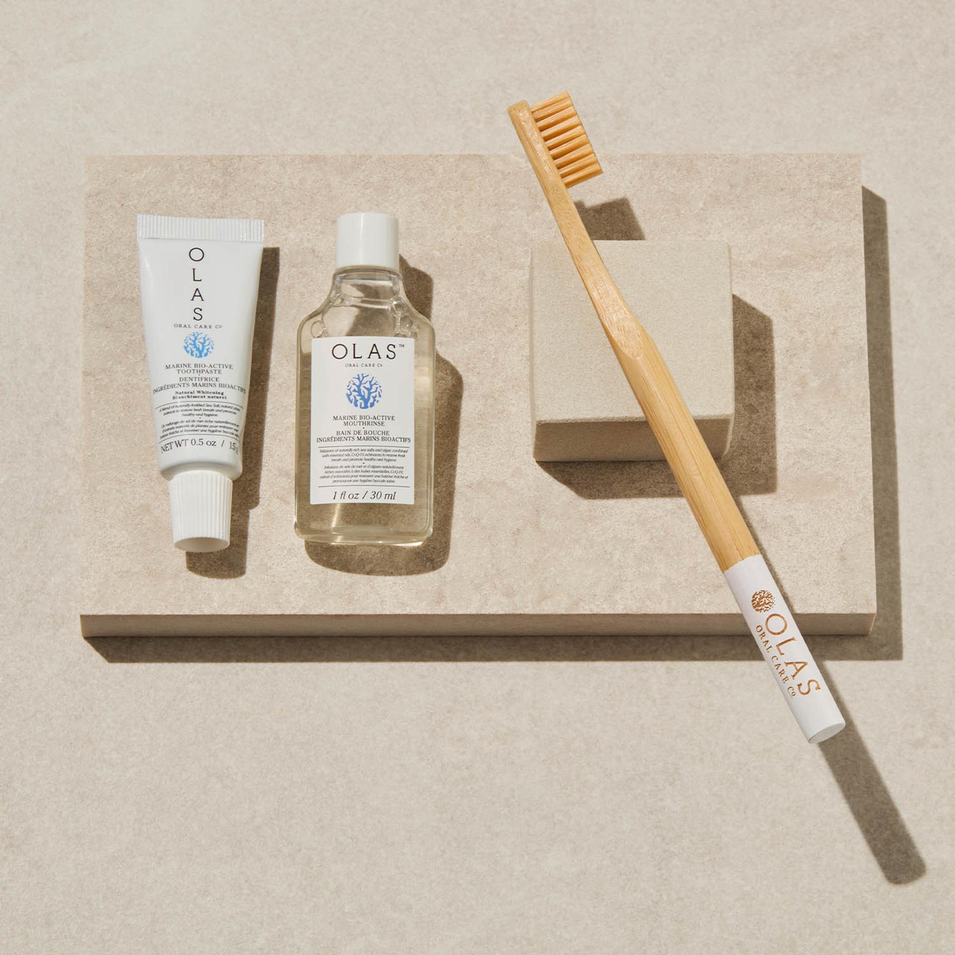 Olas mouthwash, toothpaste, and toothbrush displayed on counter