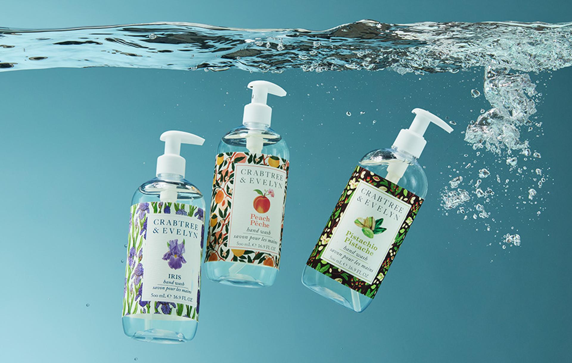 Crabtree & Evelyn Iris, Peach and Pistachio Hand Wash bottles submerged in water