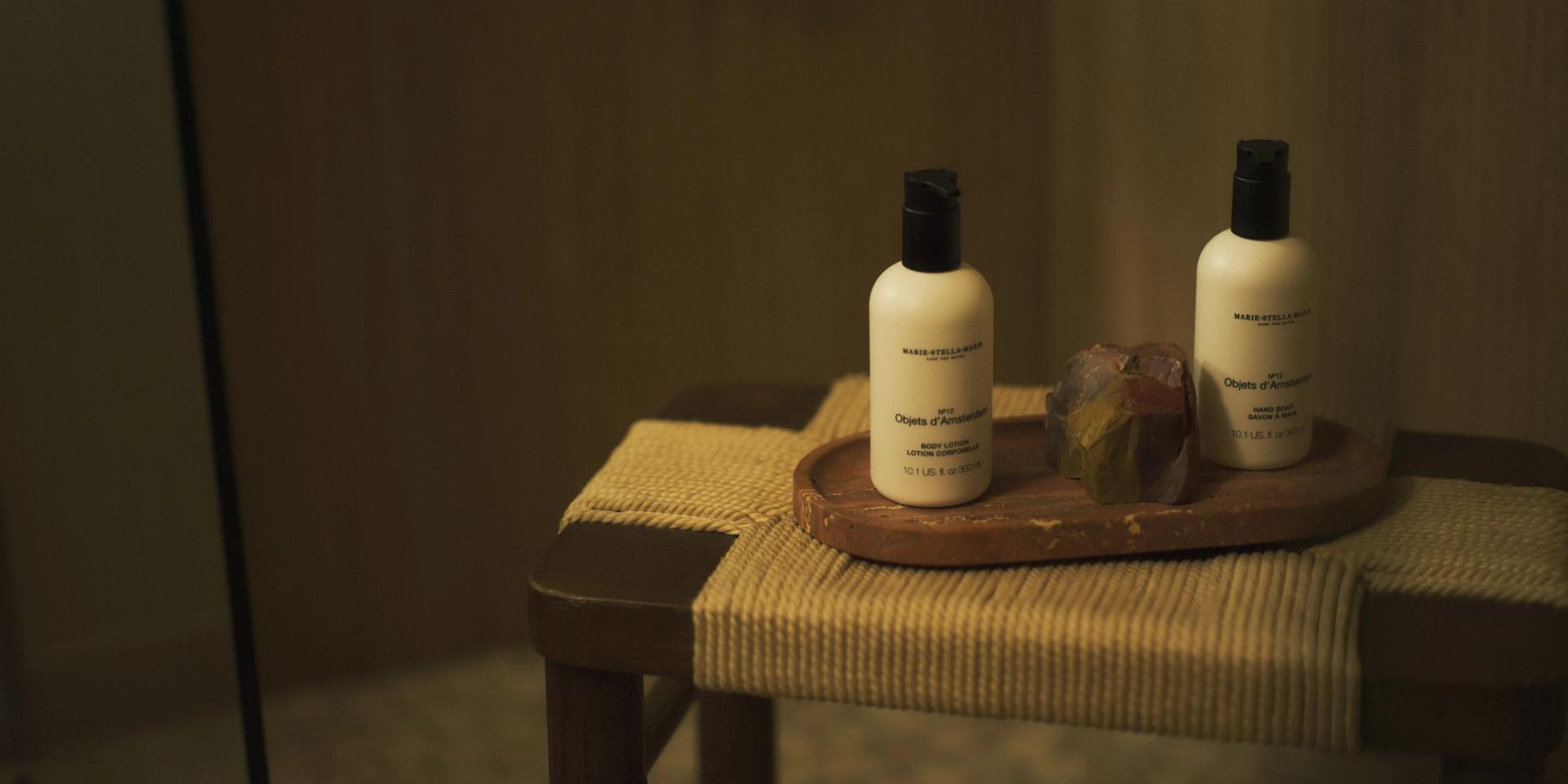 Marie Stella Maris Objets d'Amsterdam Hand Soap and Body Lotion dispensers on wooden shower stool