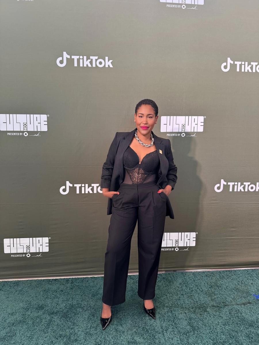 Denise Upshaw in a black suit on the CultureCon step and repeat