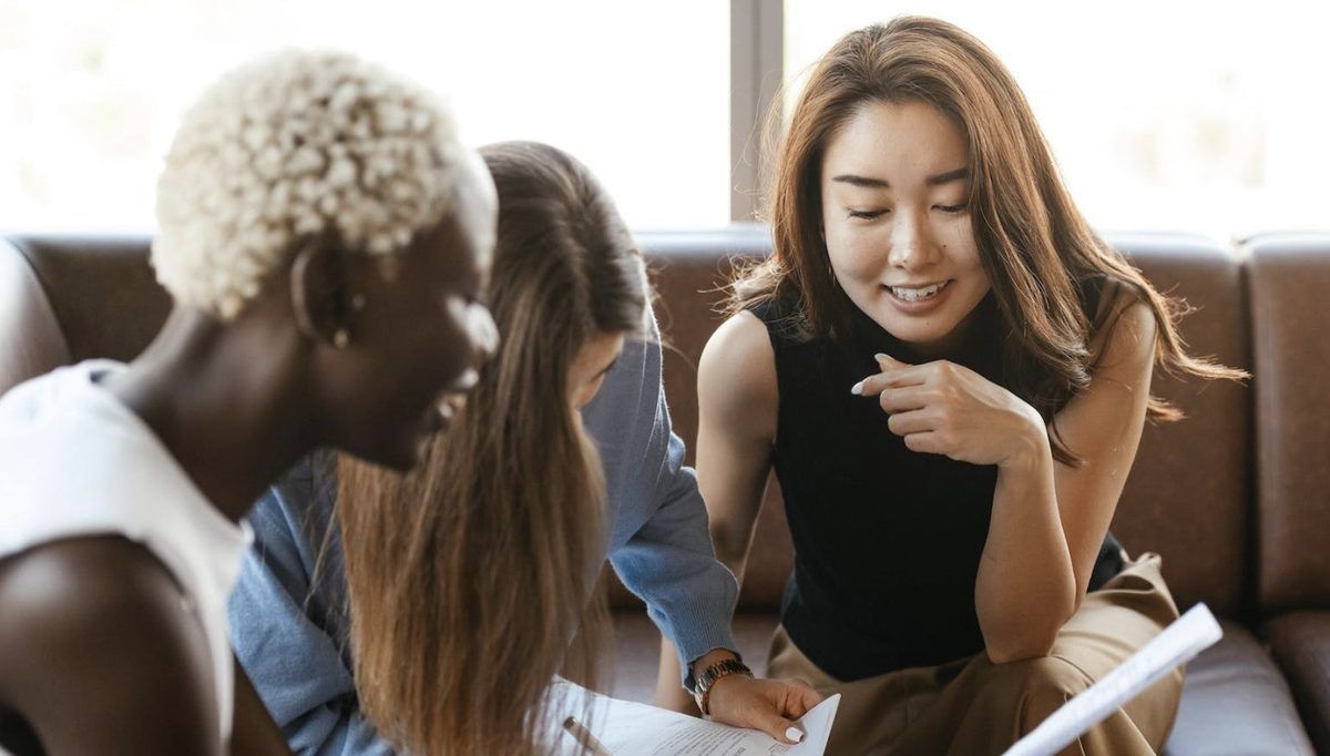 Diverse women conversing and supporting each other
