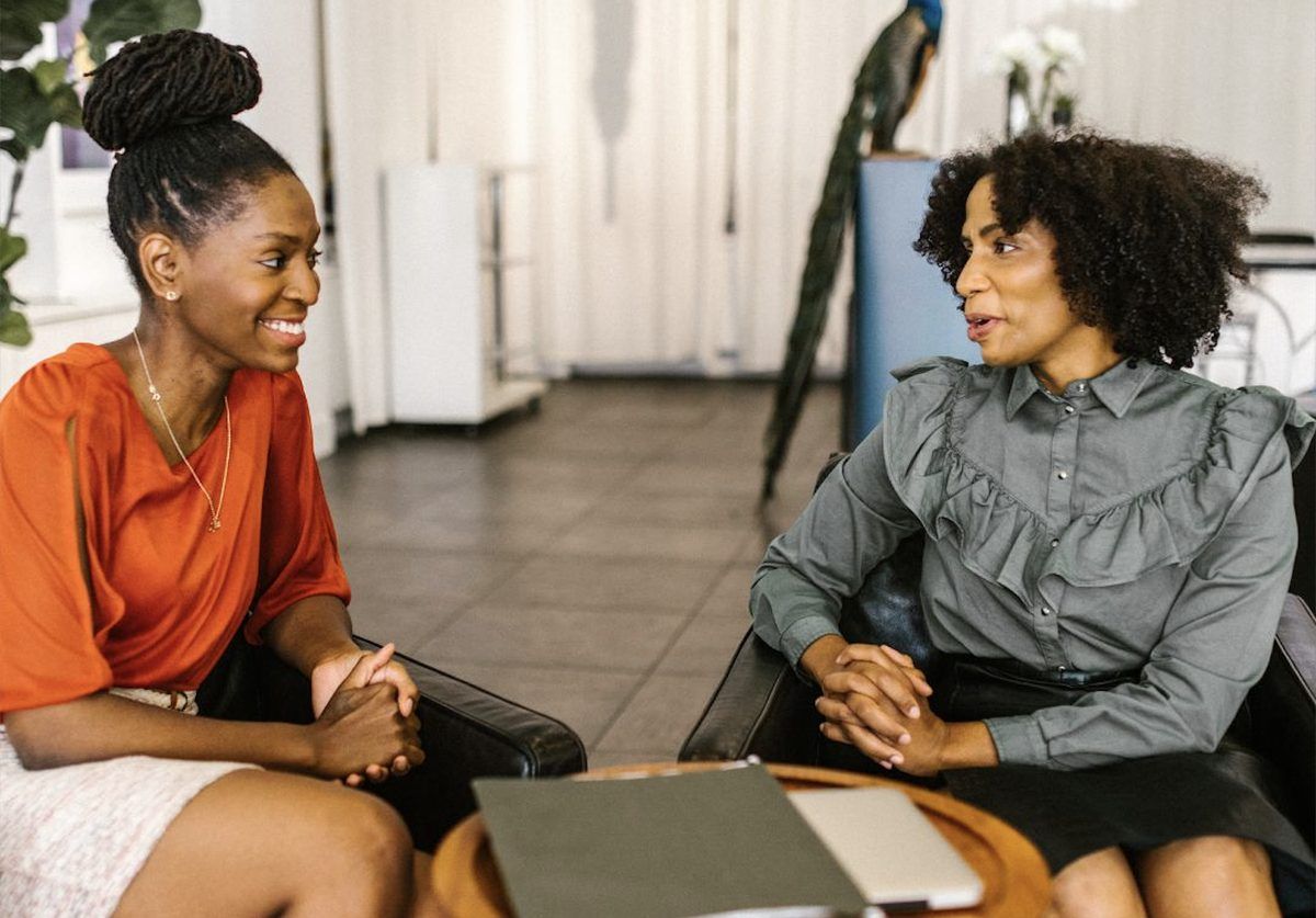 Two Joyful Black Women at Work
