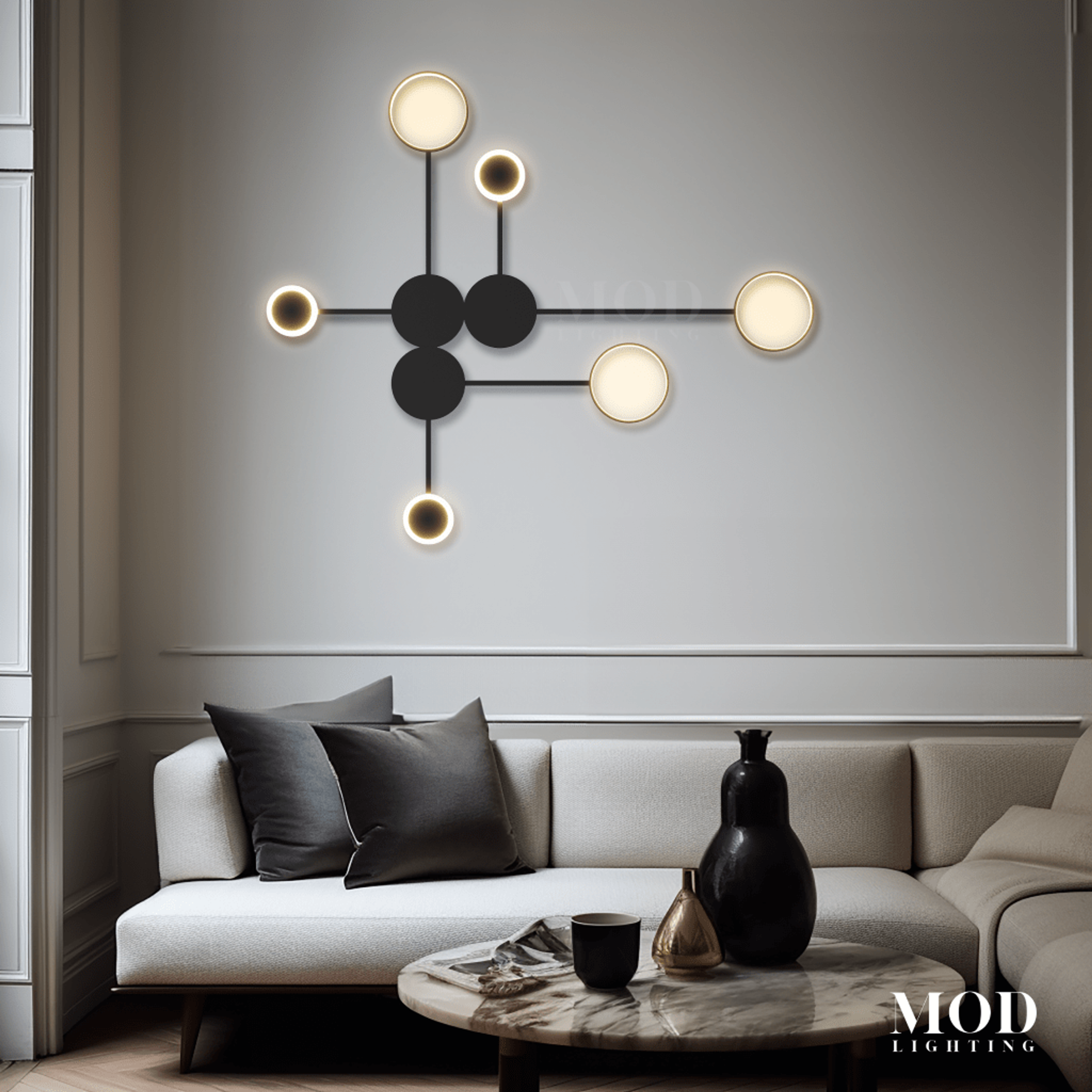 Link black wall light, connected dot-and-line orbs with white opal globes, over a sofa in a living room