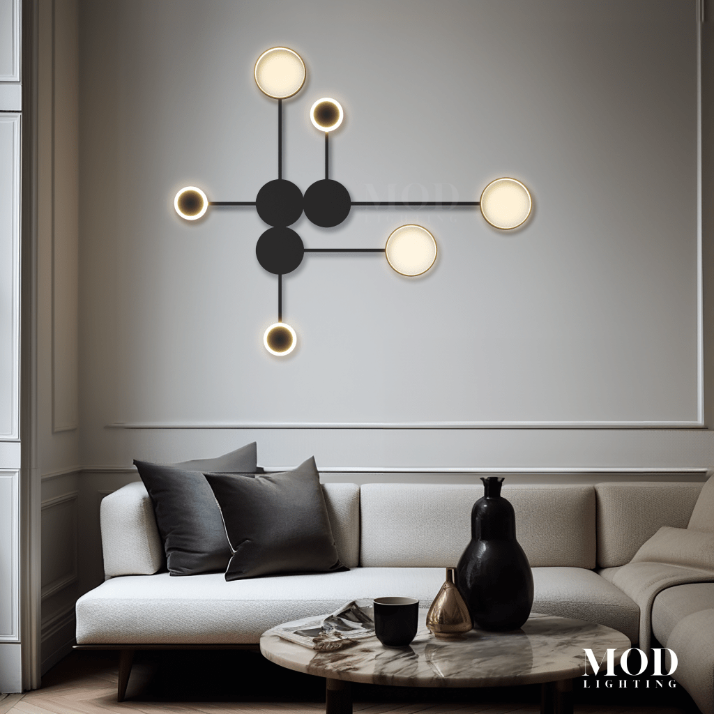 Link black wall light, connected dot-and-line orbs with white opal globes, over a sofa in a living room