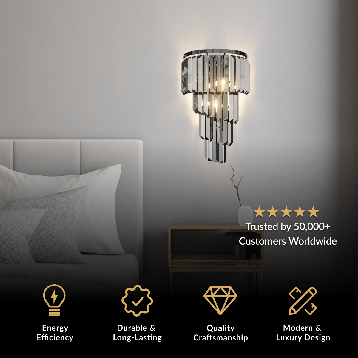 Umbra wall sconce, black tiered frame with fringe crystals, mounted beside a bed