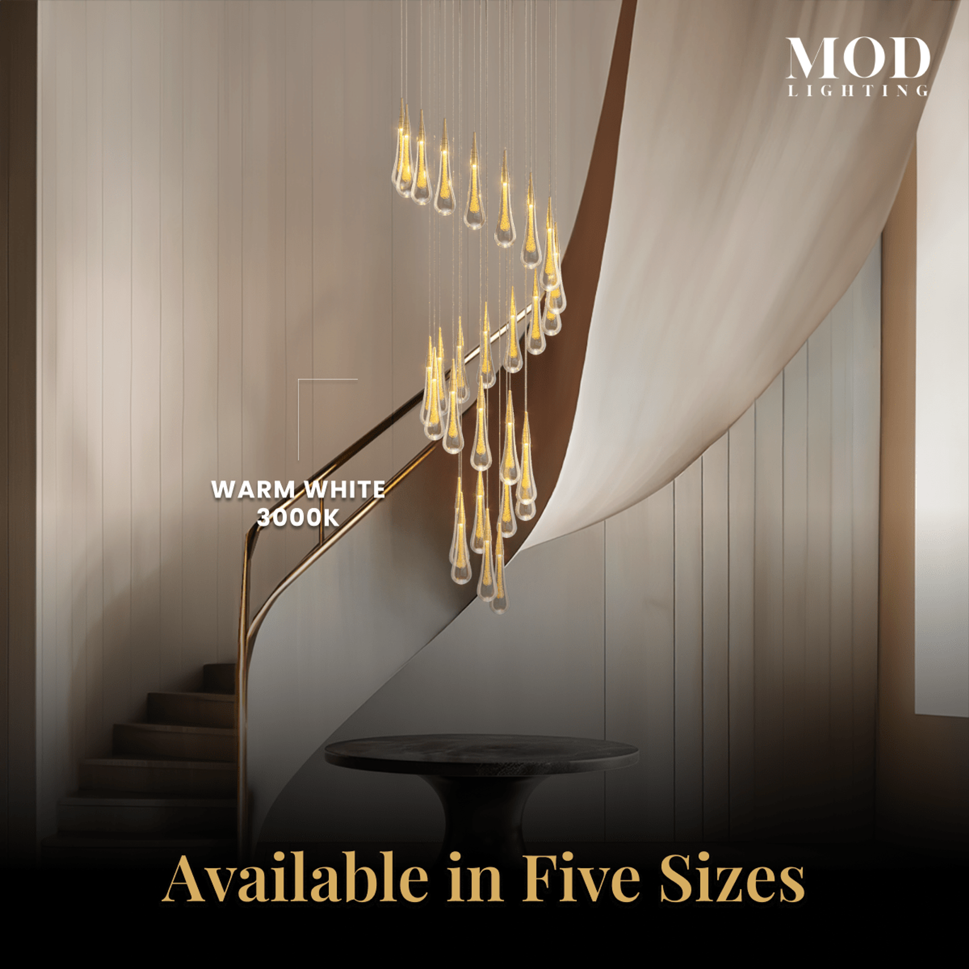 Indra chandelier, warm white 3000K crystal teardrops cascading along a curved staircase wall