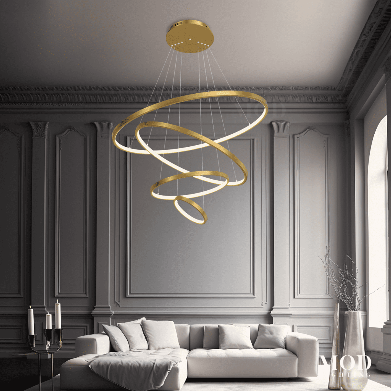 Janet gold spiral ring chandelier with LED bars over a sofa in a paneled gray living room