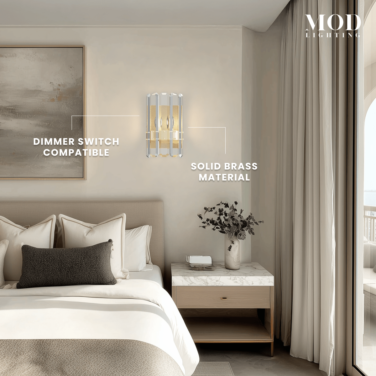 Lustre brushed-gold crystal wall sconce with faceted crystal panels beside a bed, noting dimmable and solid brass