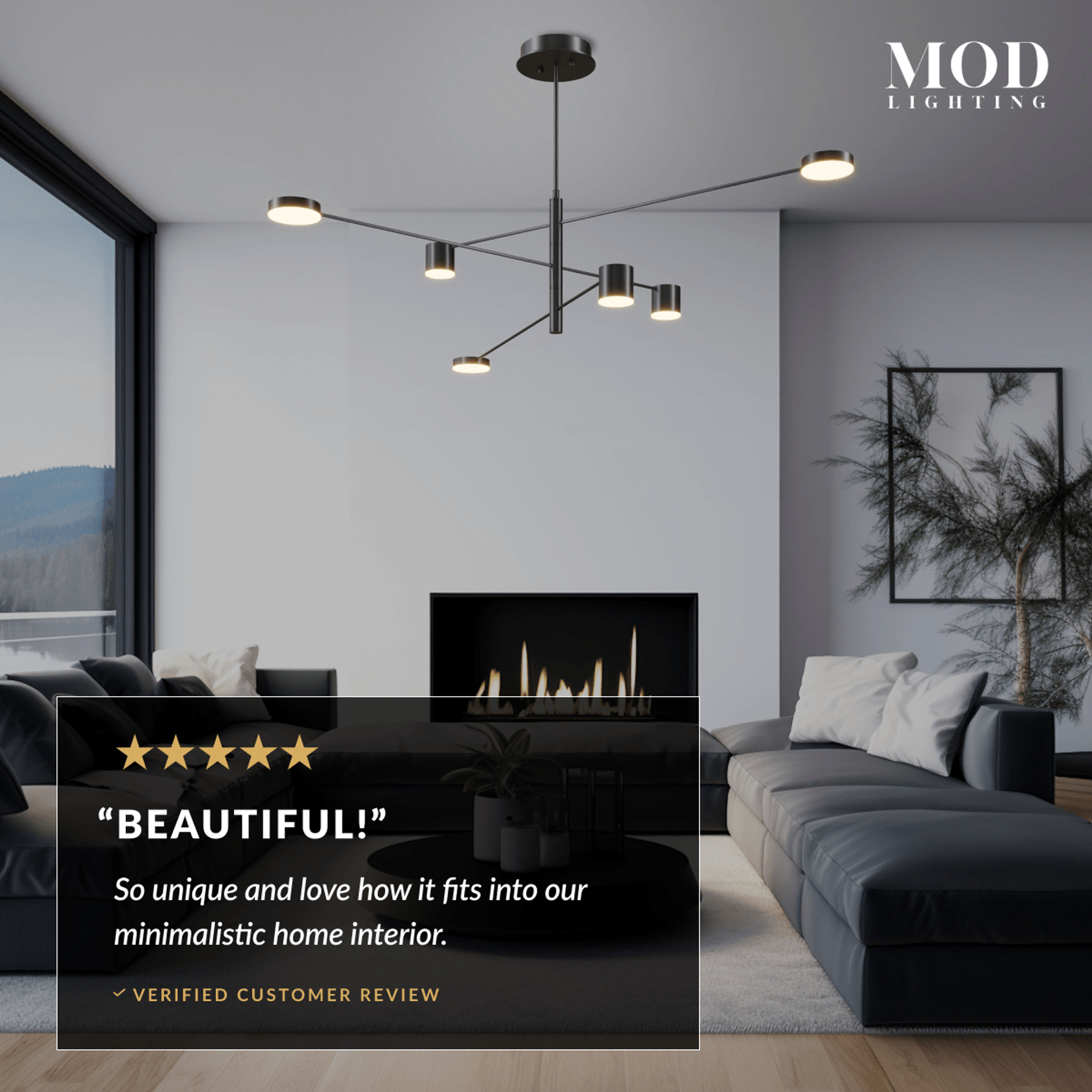 Lynx chandelier in black finish over a grey sectional in a minimalist living room with mountain view