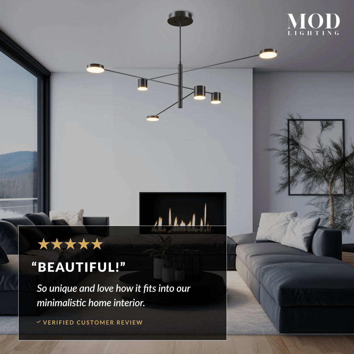 Lynx chandelier in black finish over a grey sectional in a minimalist living room with mountain view