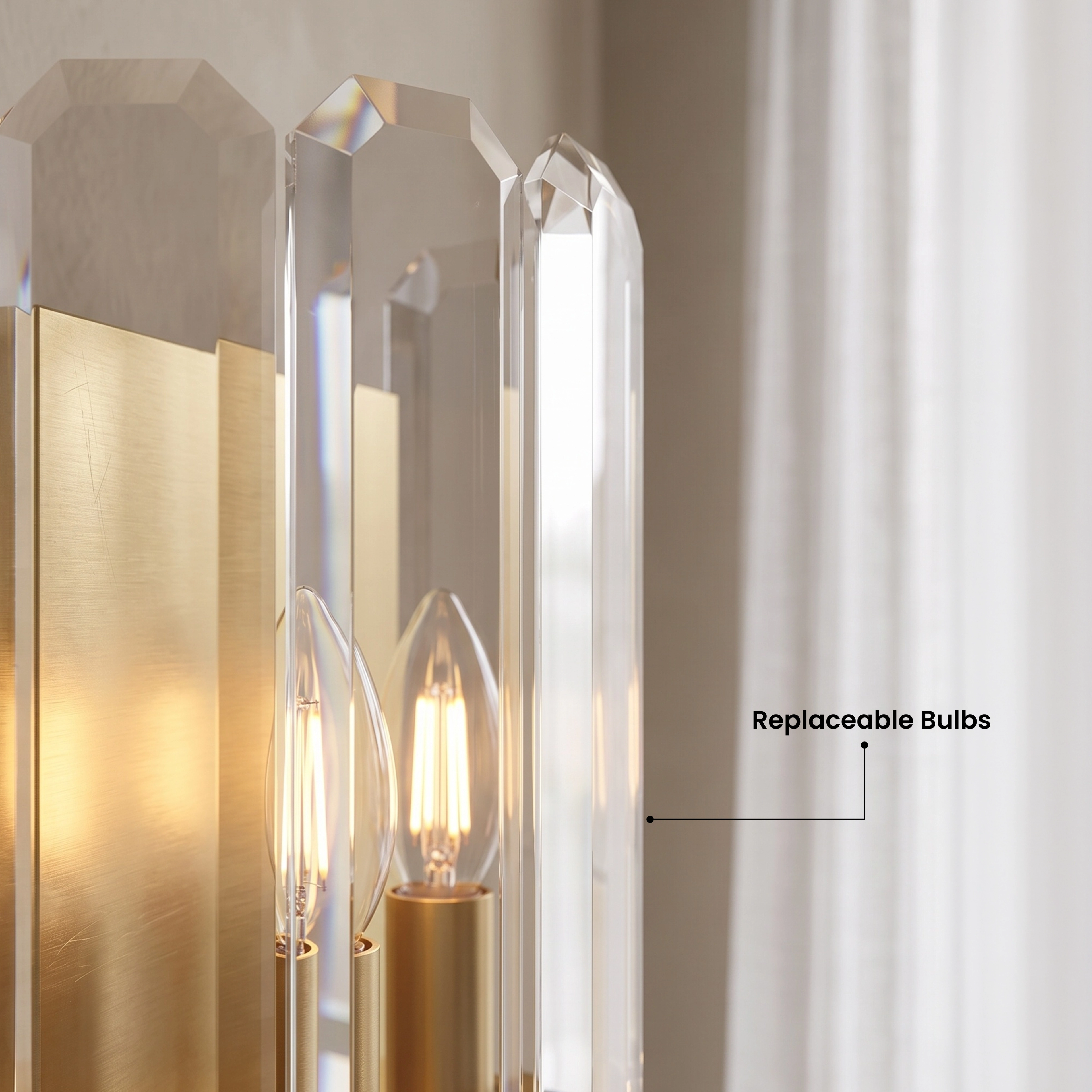 Lustre brushed-gold crystal wall sconce with faceted crystal panels on a living room wall, warm-white glow