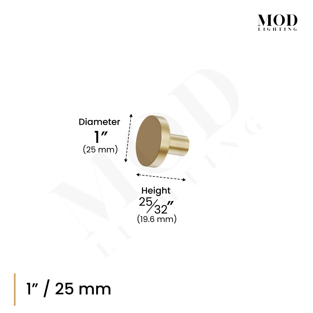 Balmuto brushed-gold flat round cabinet knob mounted on a white wood cabinet door