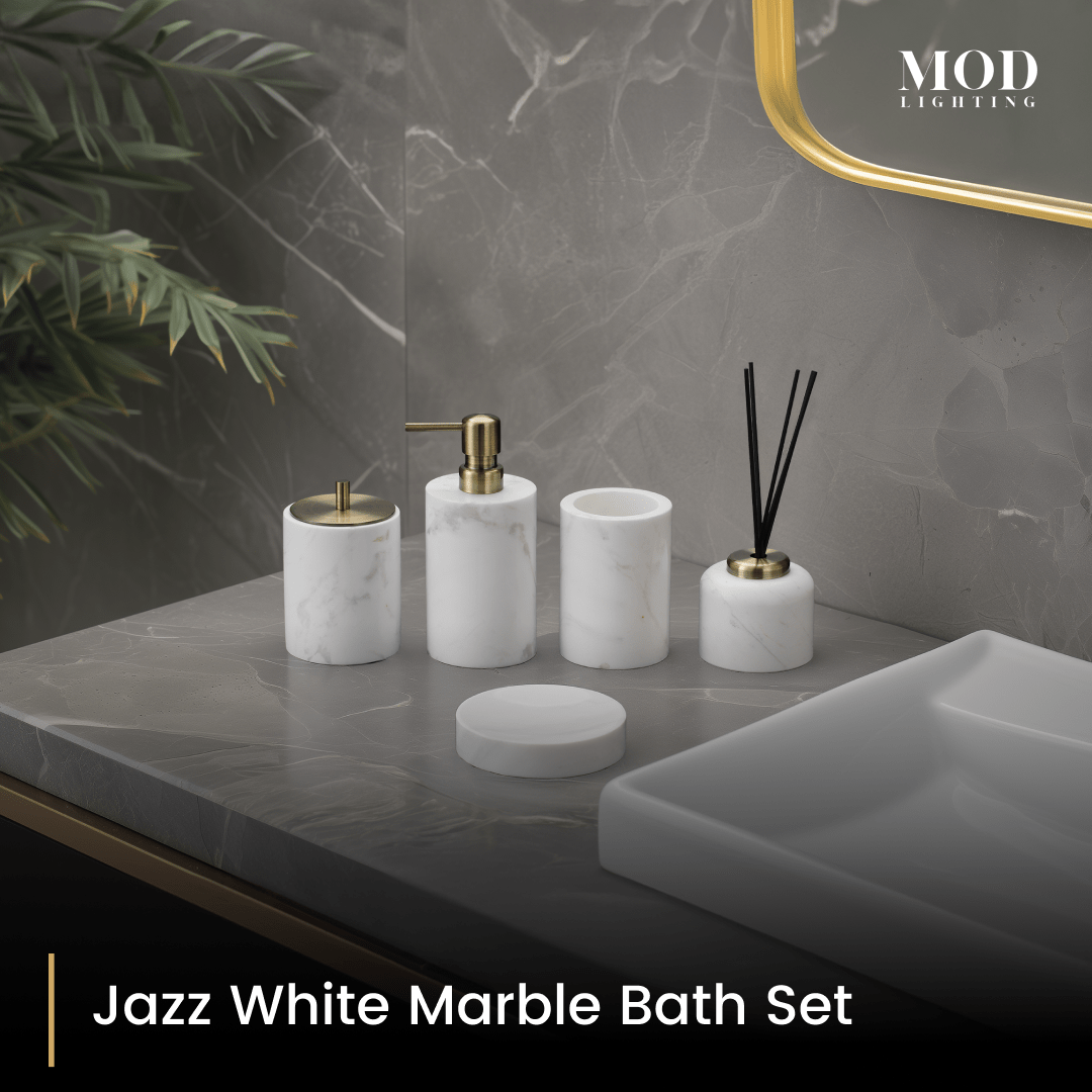 Jazz White Marble Bath Set, white marble soap pump, holder, jar and reed diffuser with gold accents on a grey vanity