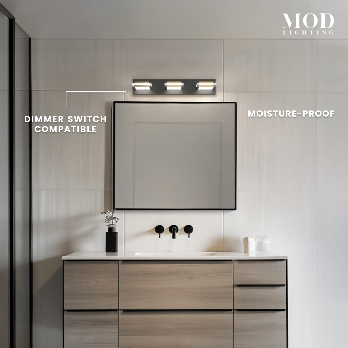 Willow three-light black-and-gold cube vanity light over a mirror, dimmer-compatible and moisture-proof