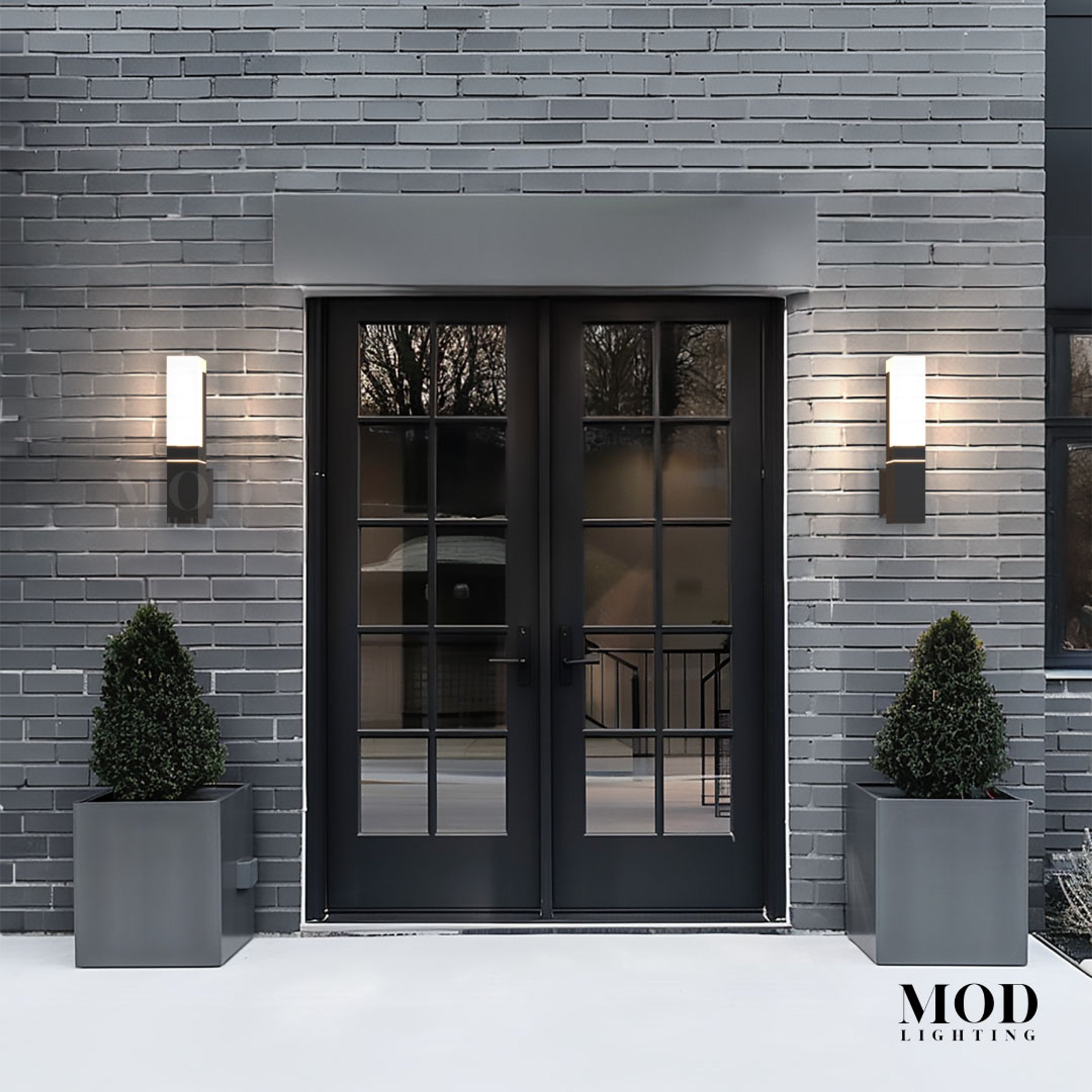 Falcon outdoor sconces, black wall fixtures with warm LED glow, flanking a French entry door