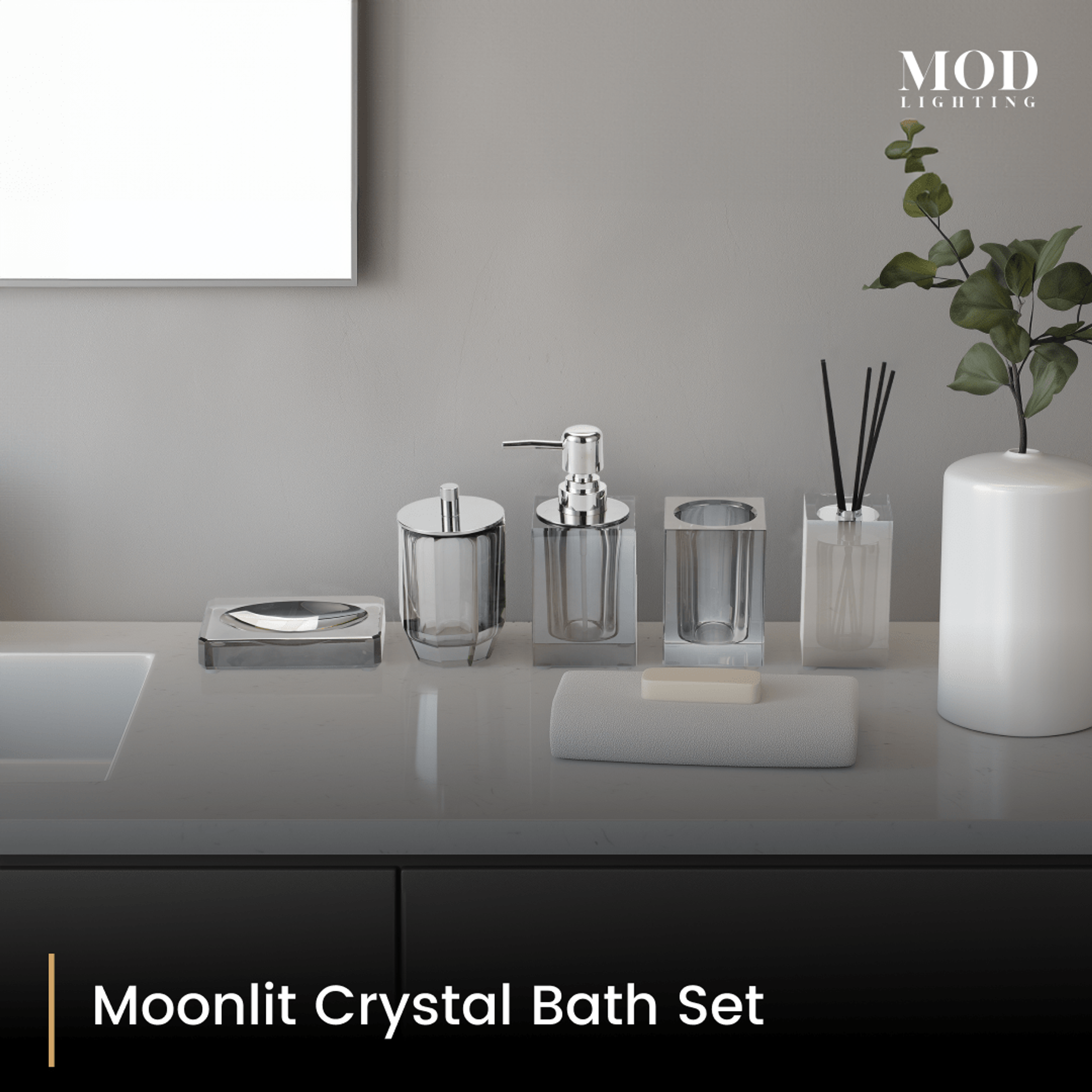Moonlit Crystal Bath Set, smoky grey crystal soap pump, holder and jars lined up on a light grey vanity