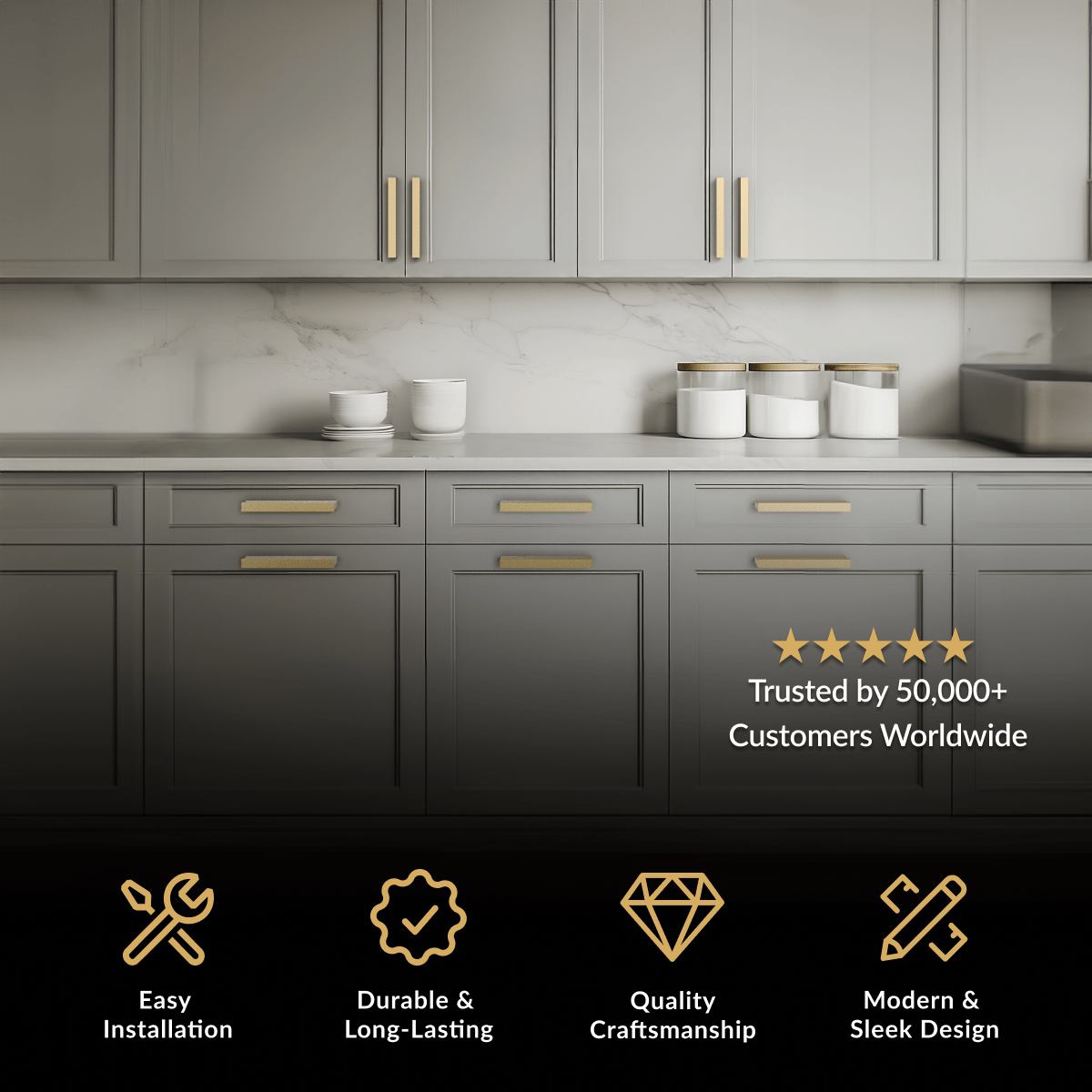 Innis Cabinet Pull in brushed gold, bar pulls on grey cabinets with marble backsplash and countertop