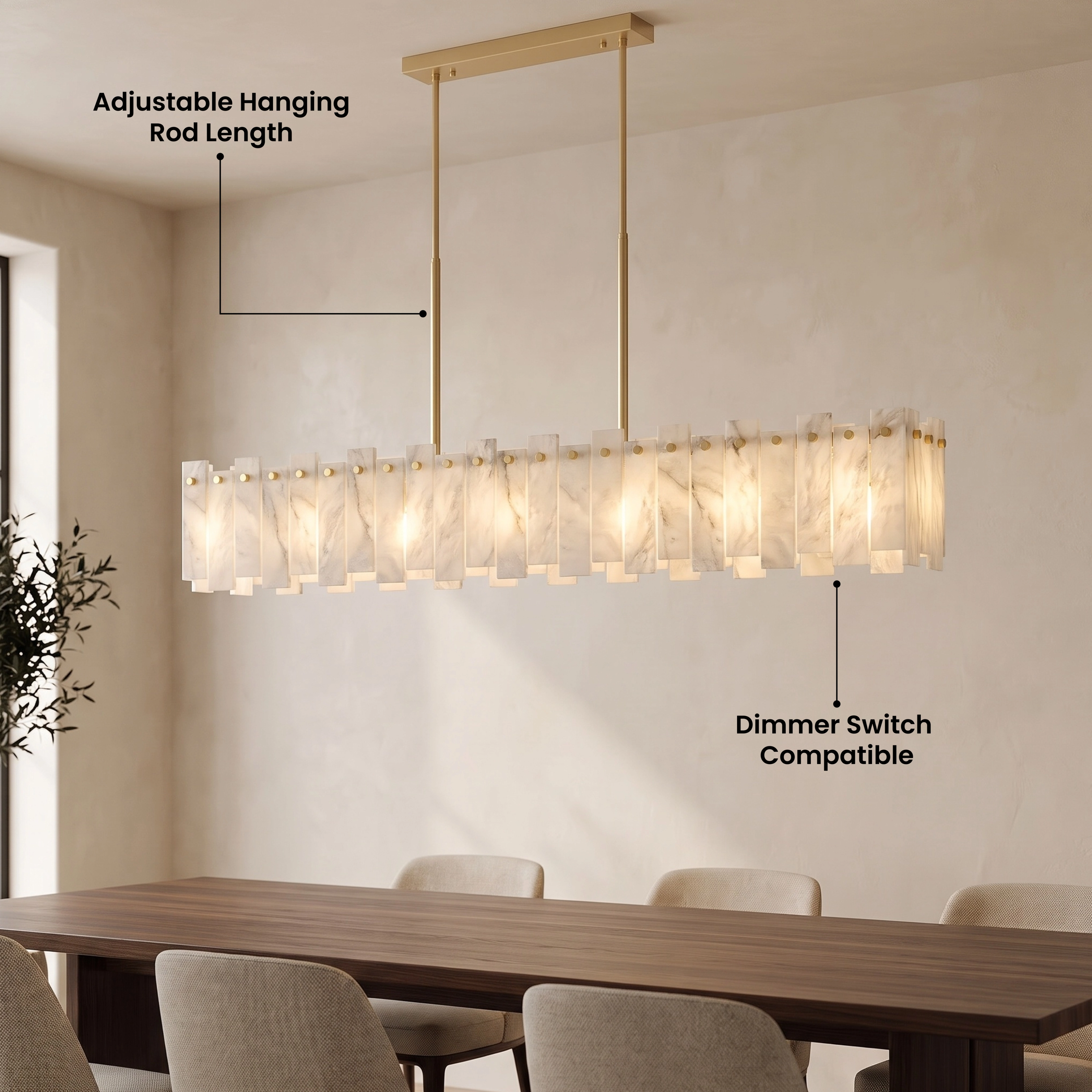 Velina Pendant gold linear alabaster bar of white panels over a dining table beside a stone wall