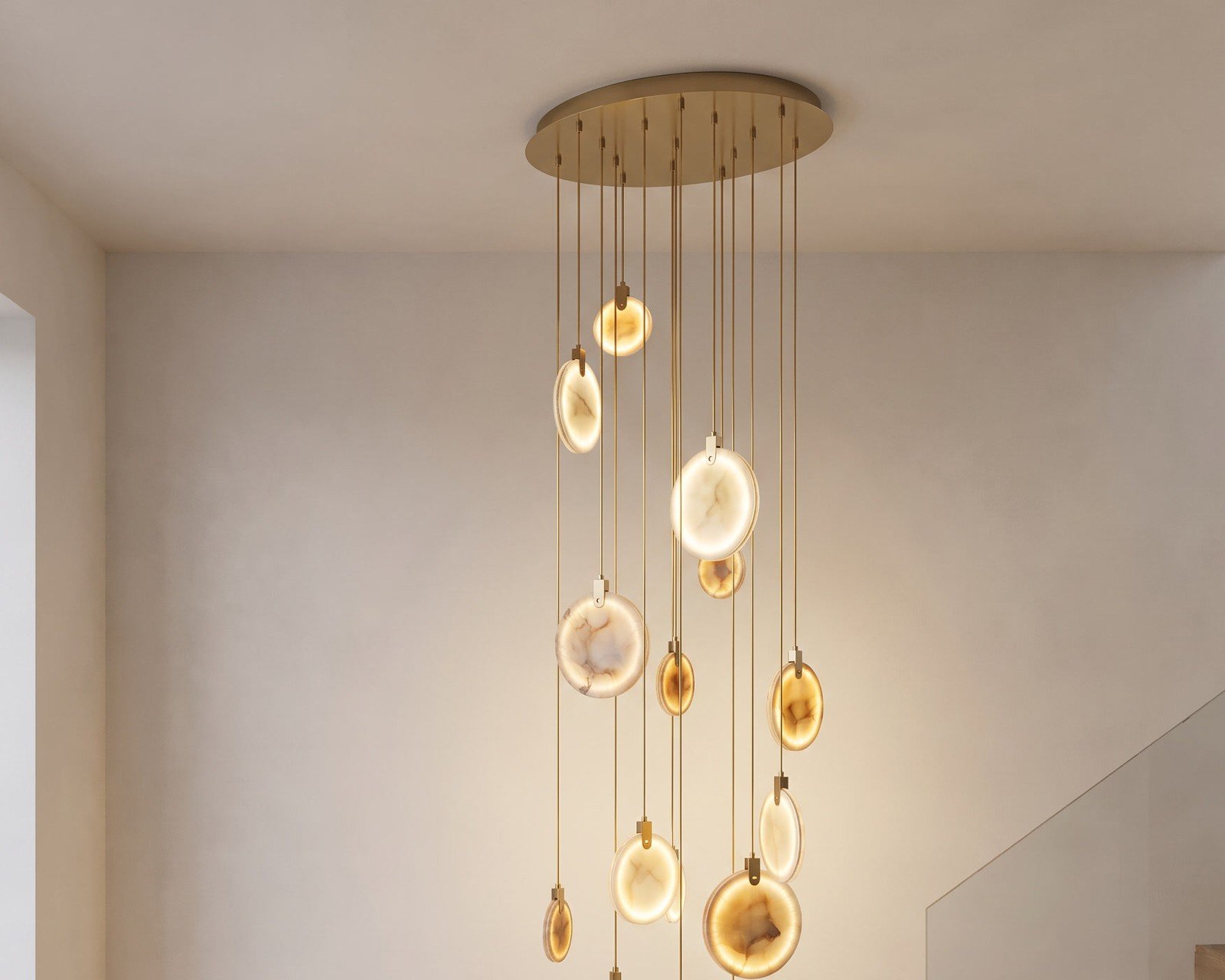 Marble cascading chandelier beside a staircase